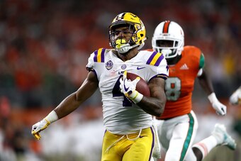ARLINGTON, TX - SEPTEMBER 02:  Nick Brossette #4 of the LSU Tigers runs for a touchdown against the Miami Hurricanes in the first quarter during the AdvoCare Classic at AT&T Stadium on September 2, 2018 in Arlington, Texas.  (Photo by Ronald Martinez/Gett