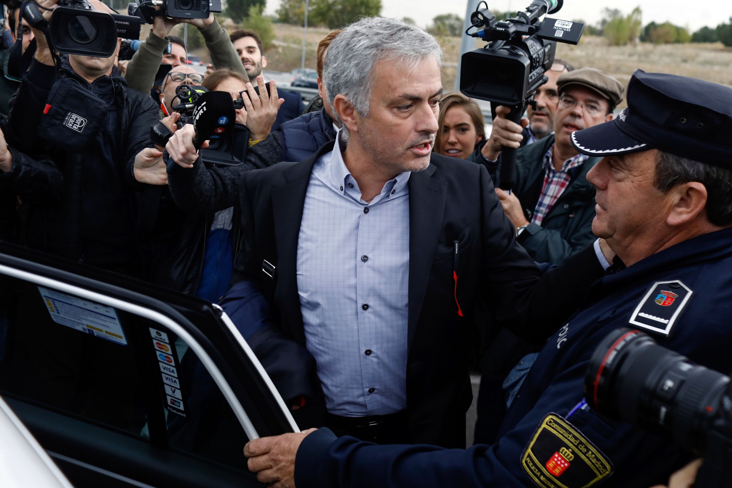 Manchester United's Portuguese manager Jose Mourinho leaves the Court in Pozuelo de Alarcon, near Madrid on November 03, 2017. 
Jose was summoned by a Madrid court over accusations of tax fraud during his time in charge of Real Madrid.  / AFP PHOTO / OSCA