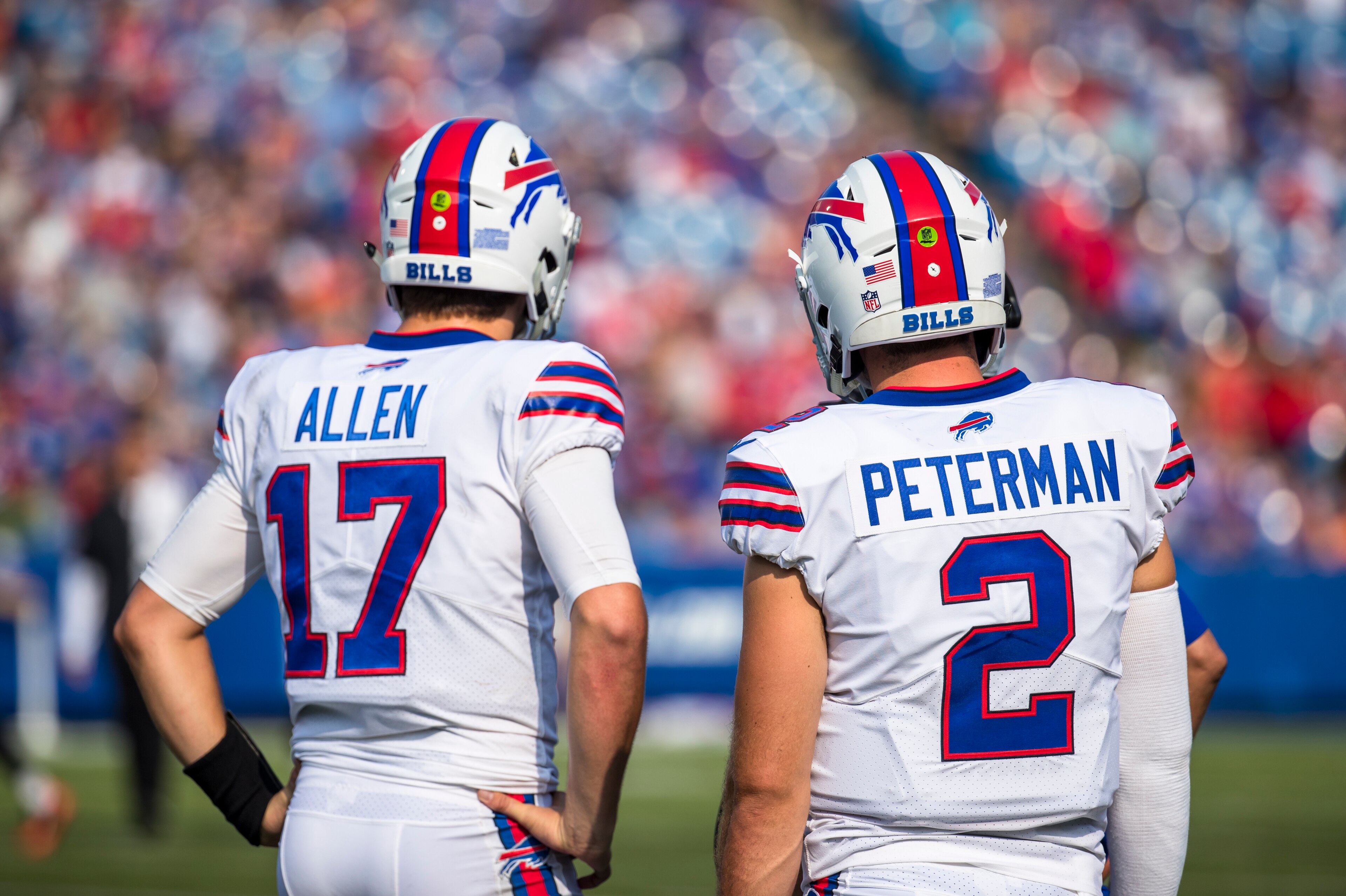 ORCHARD PARK, NY - AUGUST 26:  Josh Allen #17 and Nathan Peterman #2 of the Buffalo Bills speak with coaching staff during the preseason game against the Cincinnati Bengals at New Era Field on August 26, 2018 in Orchard Park, New York. Cincinnati defeats 