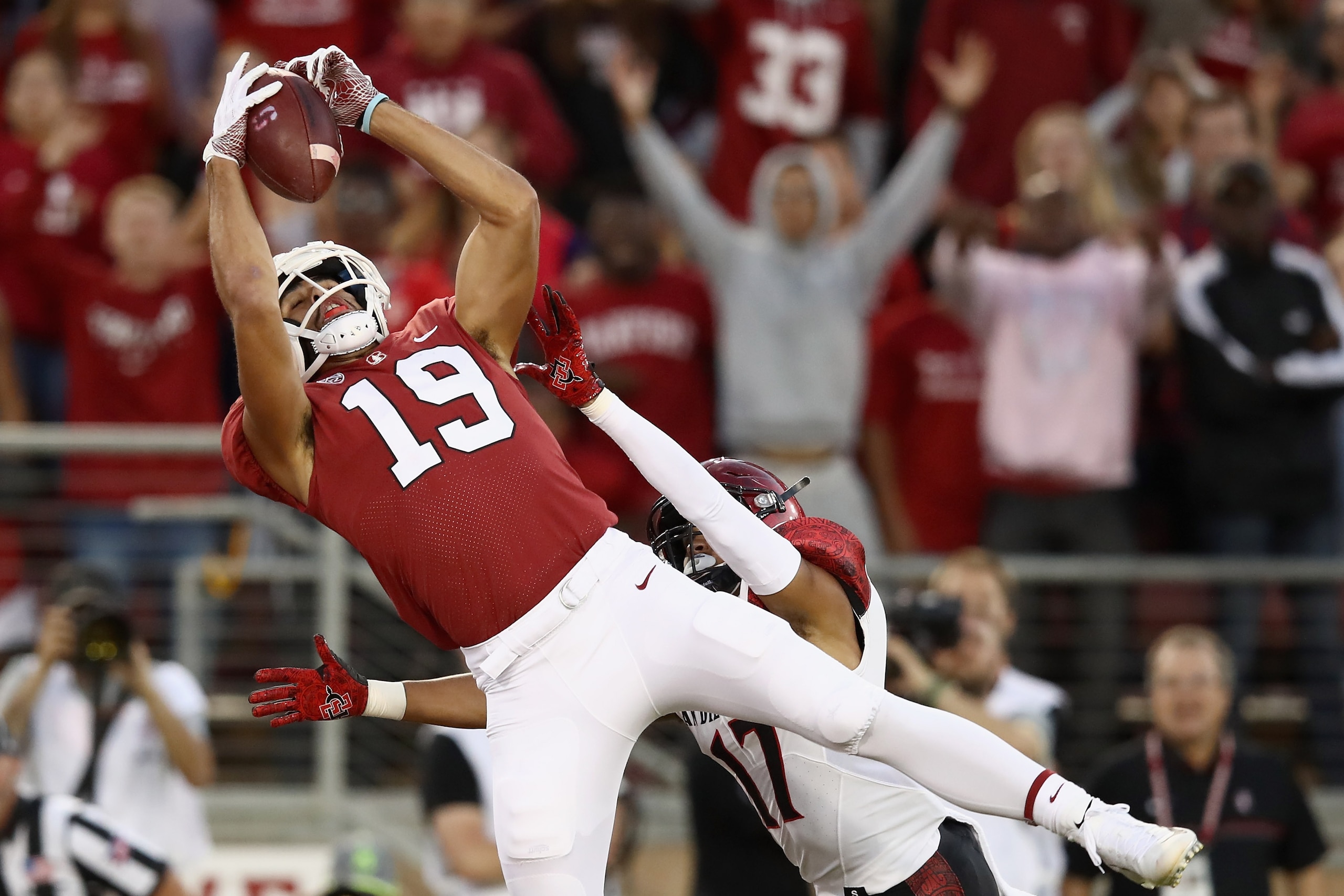 PALO ALTO, CA - AUGUST 31:  Jj Arcega-Whiteside #19 of the Stanford Cardinal catches the ball for a touchdown while covered by Ron Smith #17 of the San Diego State Aztecs at Stanford Stadium on August 31, 2018 in Palo Alto, California.  (Photo by Ezra Sha
