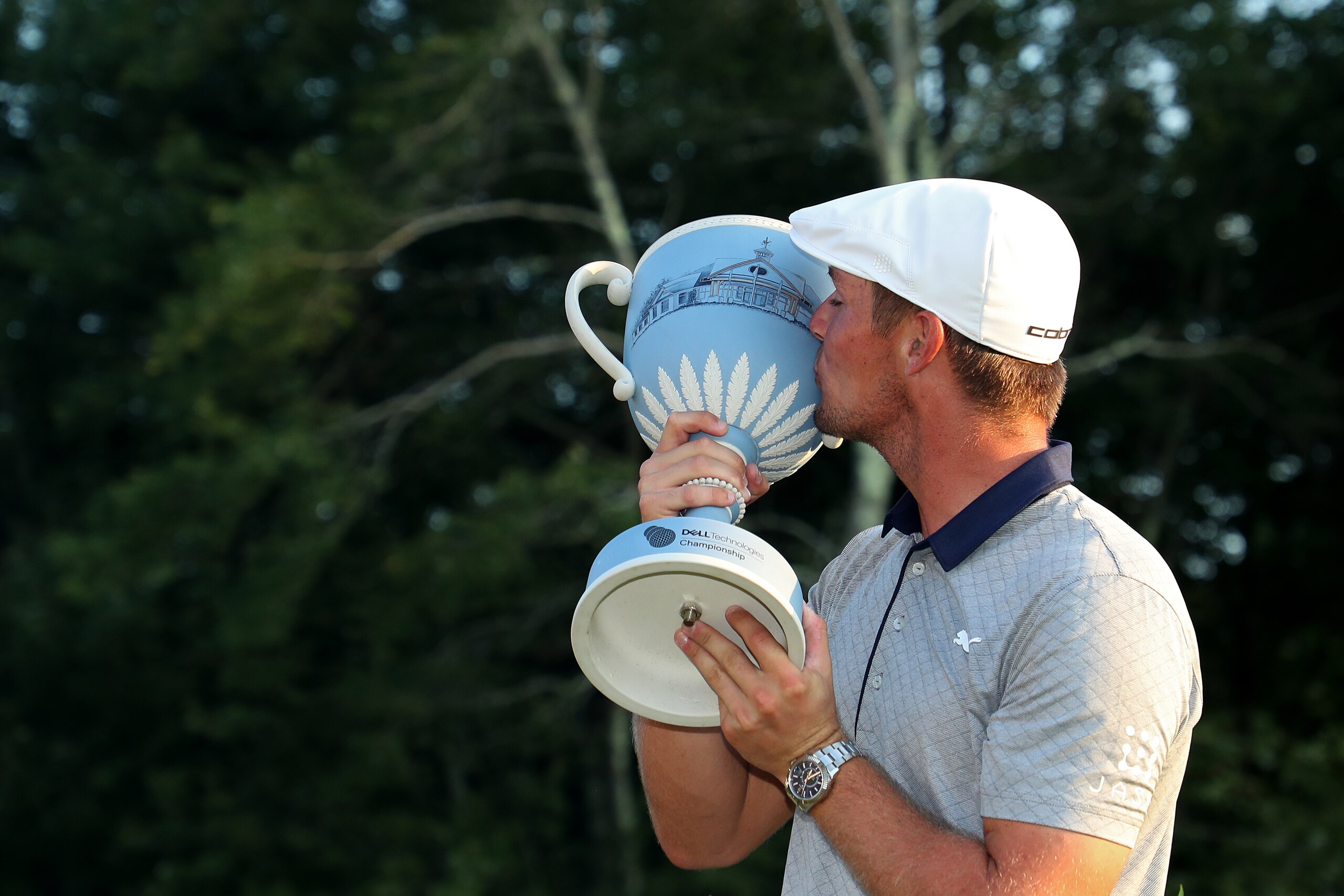 NORTON, MA - SEPTEMBER 03: Bryson DeChambeau of the United States kisses the trophy after winning the Dell Technologies Championship at TPC Boston on September 3, 2018 in Norton, Massachusetts. (Photo by Patrick Smith/Getty Images)