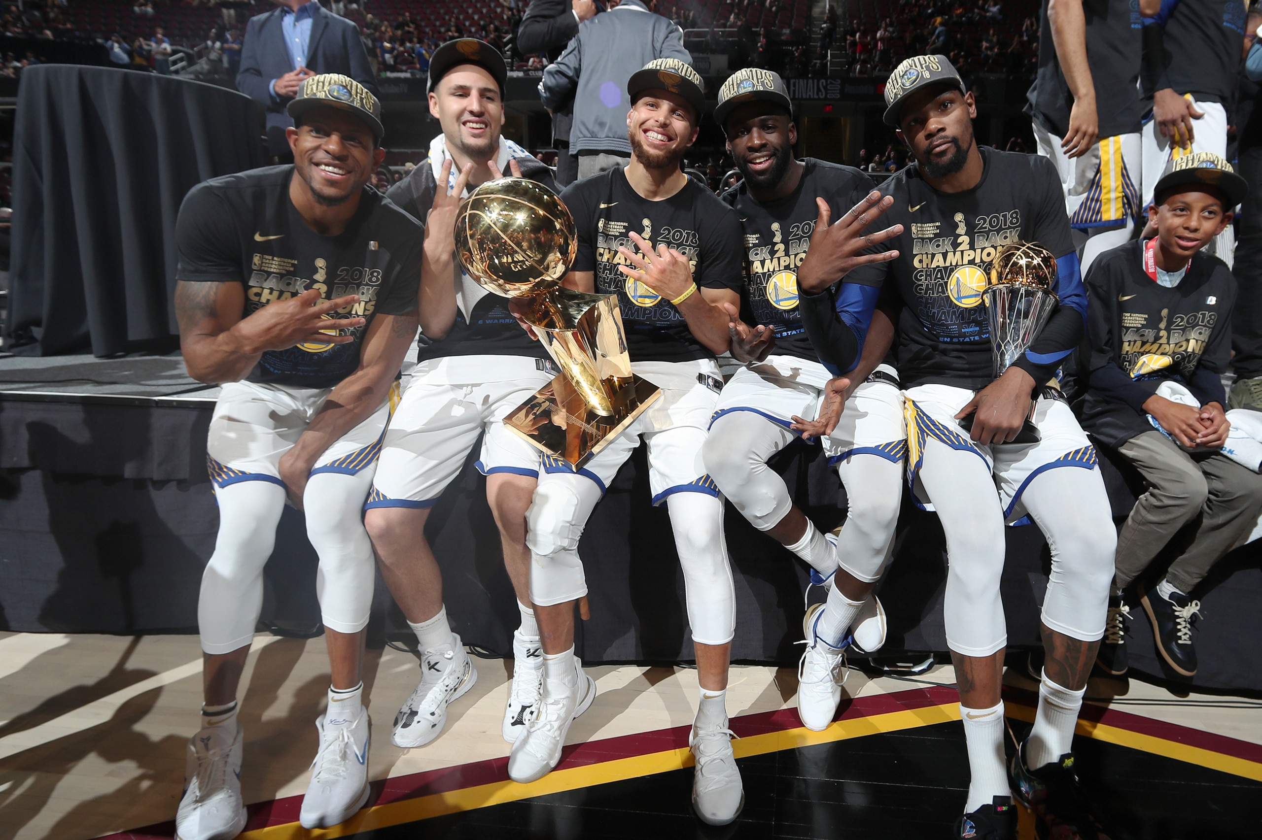 CLEVELAND, OH - JUNE 8: Andre Iguodala #9, Klay Thompson #11, Stephen Curry #30, Draymond Green #23, and Kevin Durant #35 of the Golden State Warriors pose with the Larry O'Brien Championship Trophy after Game Four of the 2018 NBA Finals against the Cleve