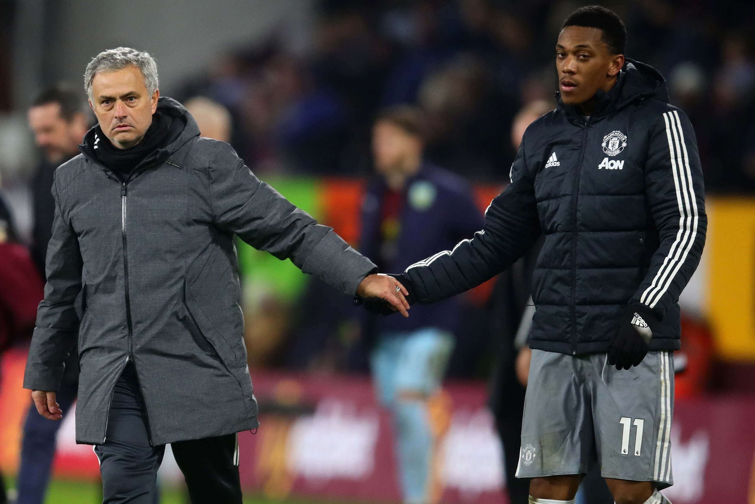 BURNLEY, ENGLAND - JANUARY 20: Jose Mourinho, Manager of Manchester United shakes hands with goalscorer Anthony Martial of Manchester United after the Premier League match between Burnley and Manchester United at Turf Moor on January 20, 2018 in Burnley, 