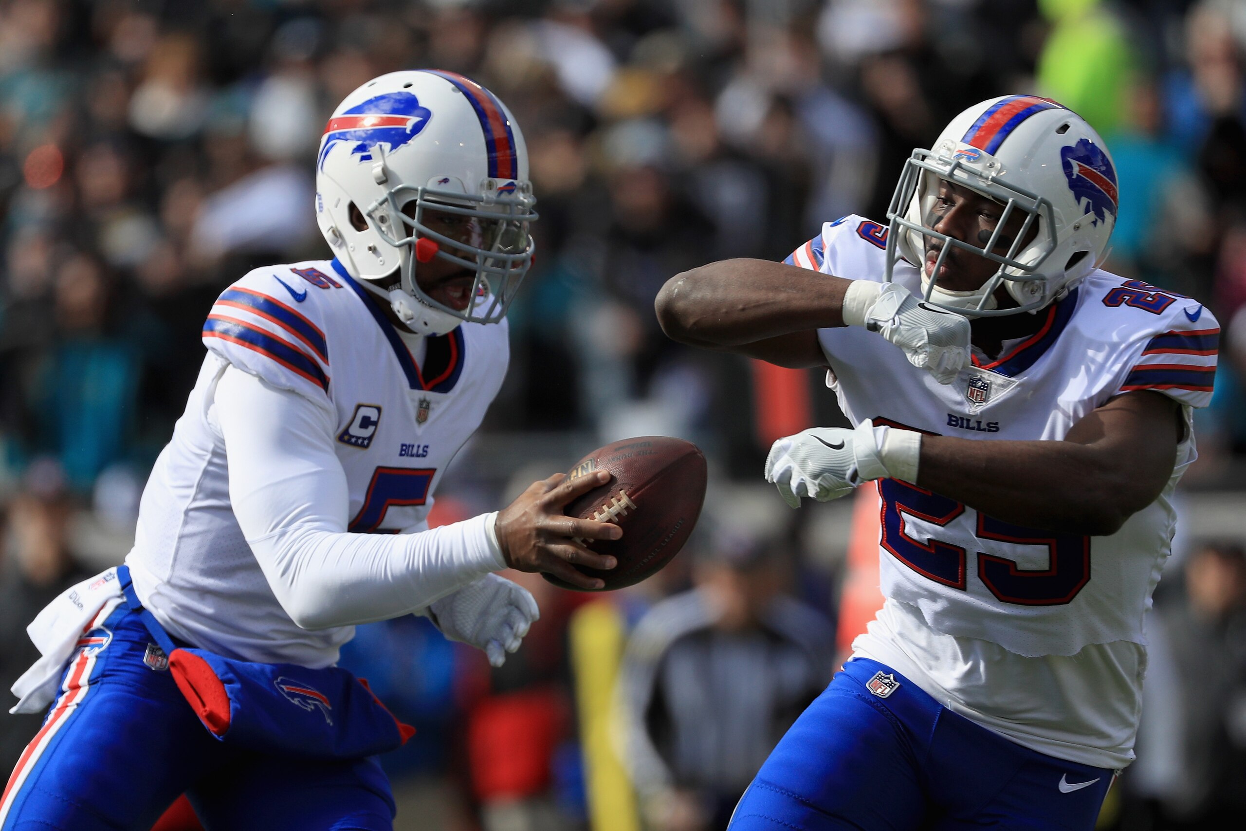 JACKSONVILLE, FL - JANUARY 07: Quarterback Tyrod Taylor #5 of the Buffalo Bills fakes a handoff to running back LeSean McCoy #25 in the first quarter against the Jacksonville Jaguars during the AFC Wild Card Playoff game at EverBank Field on January 7, 20