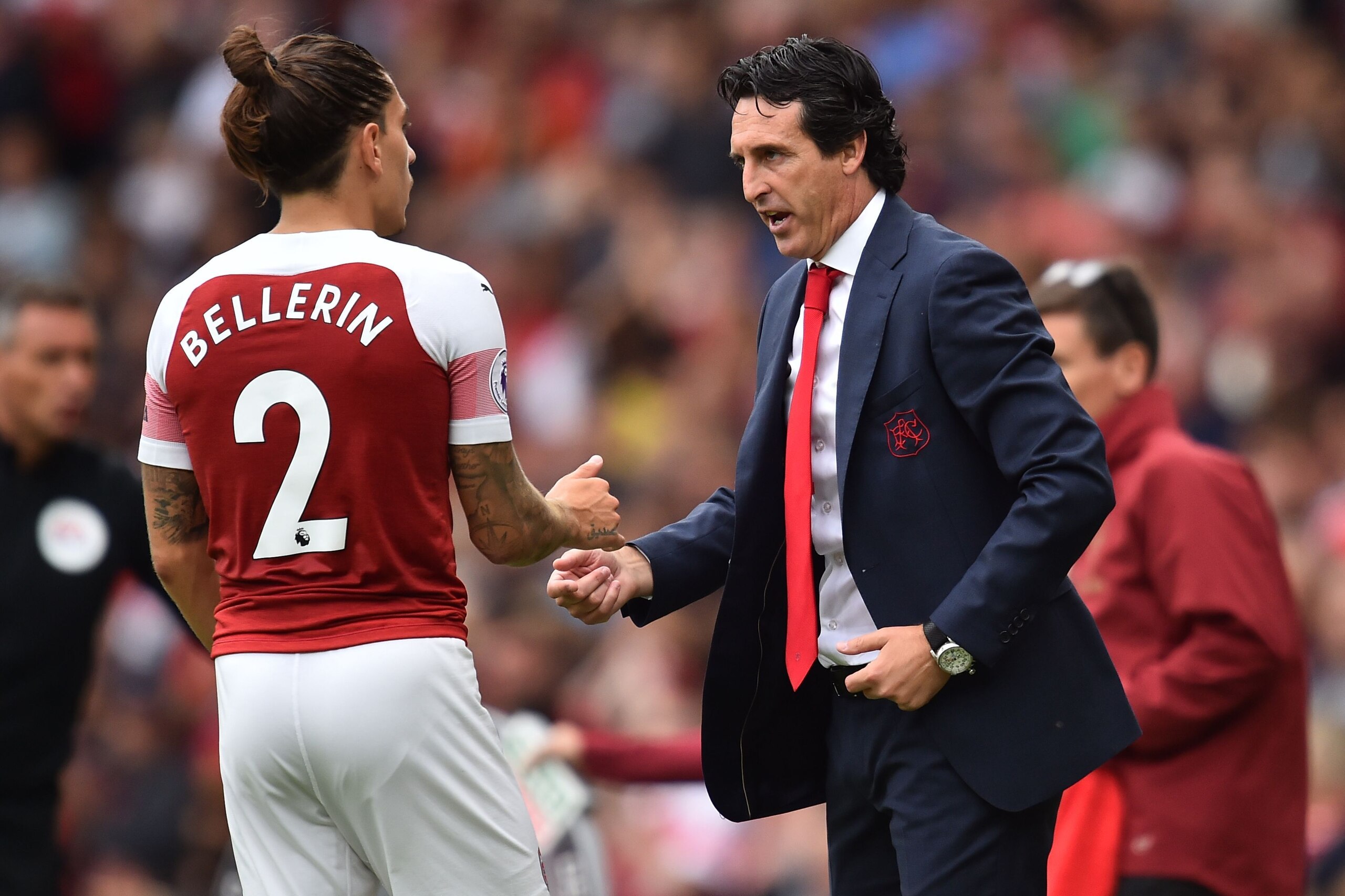 Arsenal's Spanish head coach Unai Emery speaks with Arsenal's Spanish defender Hector Bellerin (L) during the English Premier League football match between Arsenal and Manchester City at the Emirates Stadium in London on August 12, 2018. (Photo by Glyn KI Arsenal's Spanish head coach Unai Emery speaks with Arsenal's Spanish defender Hector Bellerin (L) during the English Premier League football match between Arsenal and Manchester City at the Emirates Stadium in London on August 12, 2018. (Photo by Glyn KI