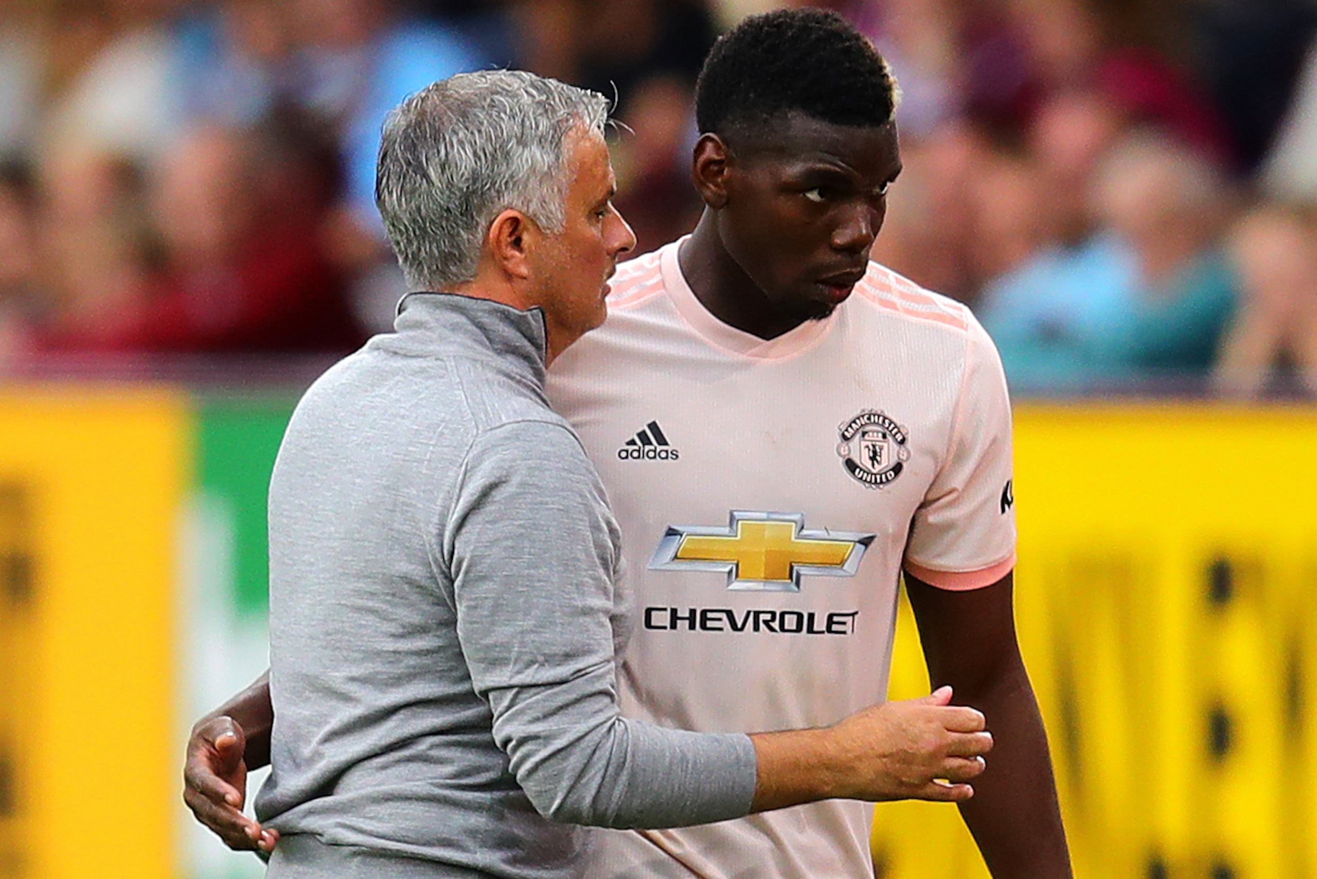 BURNLEY, ENGLAND - SEPTEMBER 02: Manchester United manager Jose Mourinho embraces Paul Pogba as he leaves the field after being substituted during the Premier League match between Burnley FC and Manchester United at Turf Moor on September 2, 2018 in Burnl