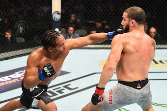DALLAS, TX - SEPTEMBER 08:  (L-R) John Dodson punches Jimmie Rivera in their bantamweight fight during the UFC 228 event at American Airlines Center on September 8, 2018 in Dallas, Texas. (Photo by Josh Hedges/Zuffa LLC/Zuffa LLC via Getty Images)