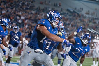 LAWRENCE, KS - SEPTEMBER 1: Wide receiver Kerr Johnson Jr. #14 of the Kansas Jayhawks celebrates a touchdown against Nicholls State Colonels at Memorial Stadium on September 1, 2018 in Lawrence, Kansas. (Photo by Ed Zurga/Getty Images)