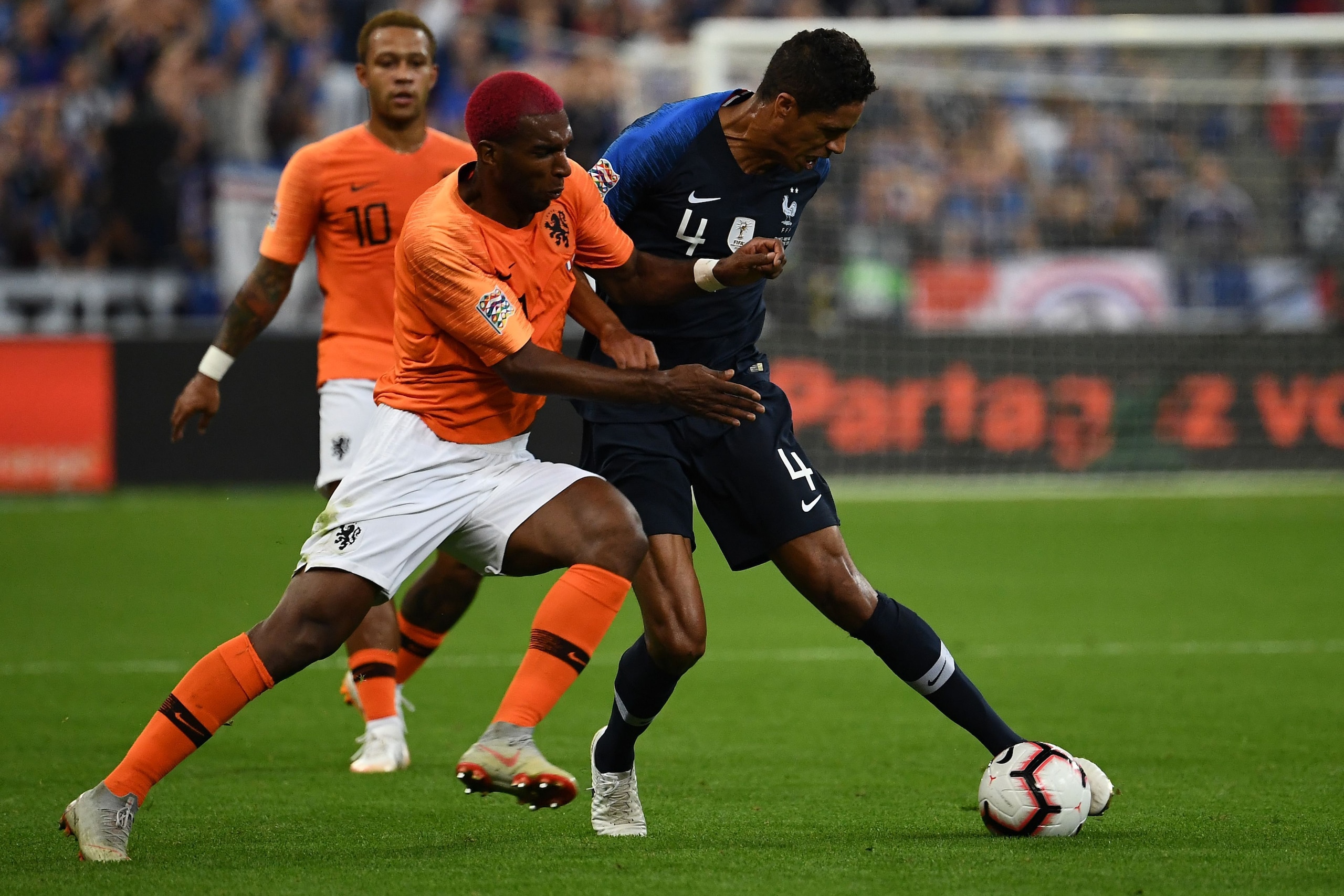 Netherlands' midfielder Ryan Babel (L) vies for the ball with France's defender Raphael Varane during the UEFA Nations League football match between France and Netherlands at the Stade de France stadium, in Saint-Denis, northern of Paris, on September 9, 