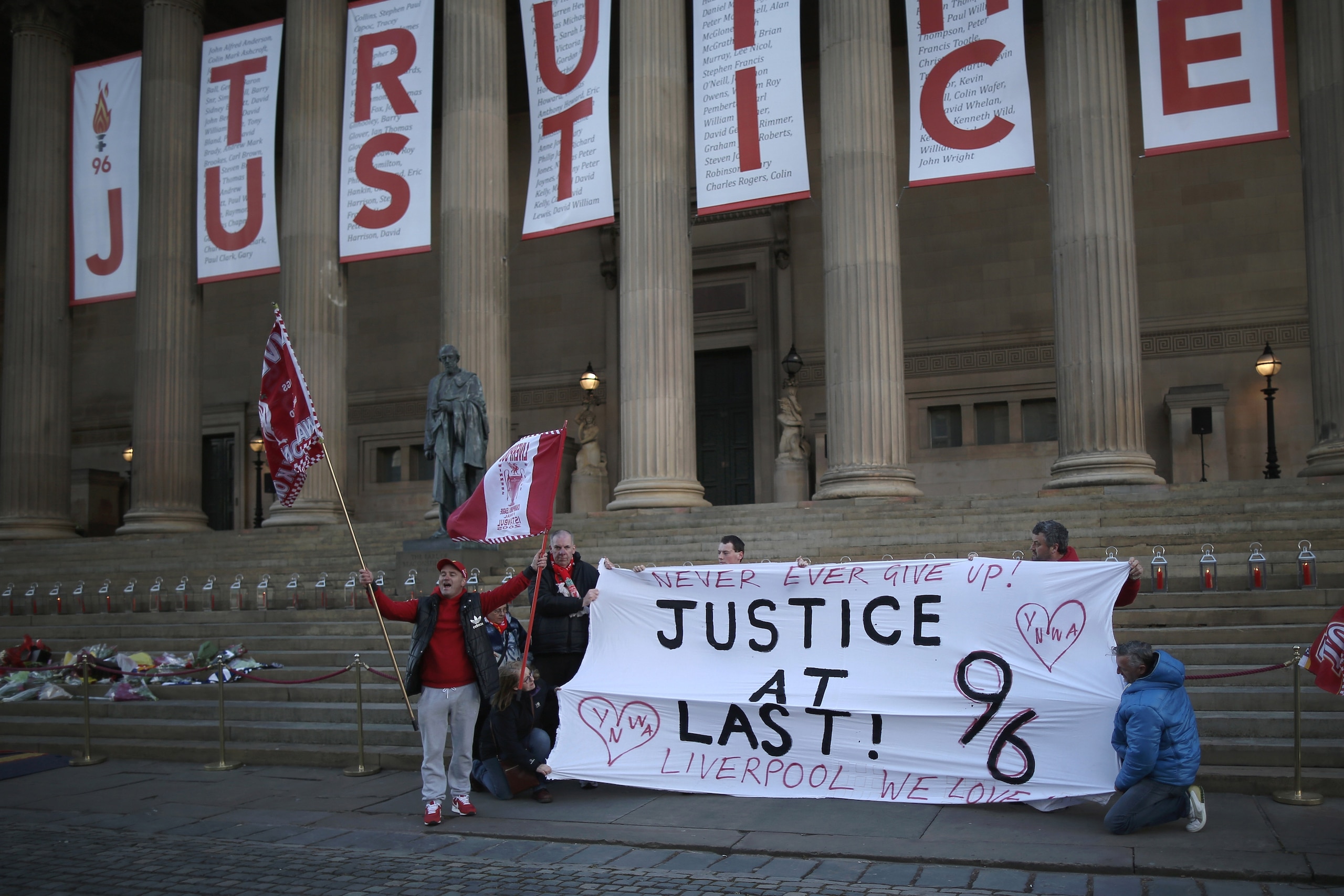 LIVERPOOL, ENGLAND - APRIL 26:  A banner reading Truth and Justice is hung from the Doric pillars of Saint George's Hall in the centre of Liverpool after today's jury inquest verdict on April 26, 2016 in Liverpool, England. The fresh inquests into the 198