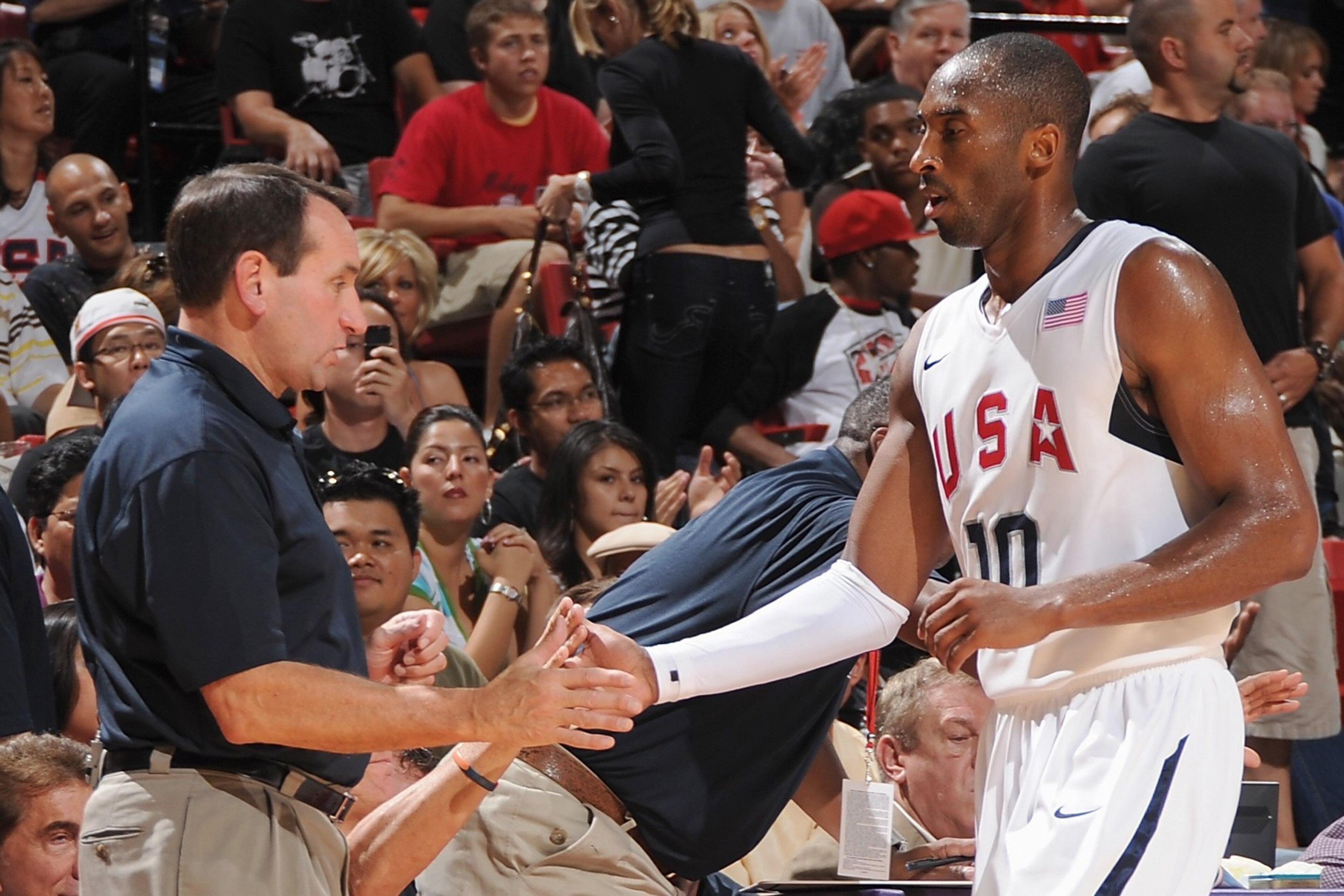 LAS VEGAS - JULY 25:  Head coach Mike Krzyzewski and Kobe Bryant #10 of the USA Basketball Men's Senior National Team high five during the State Farm USA Basketball Challenge against the Canadian National Team on July 25, 2008 at the Thomas & Mack Center 