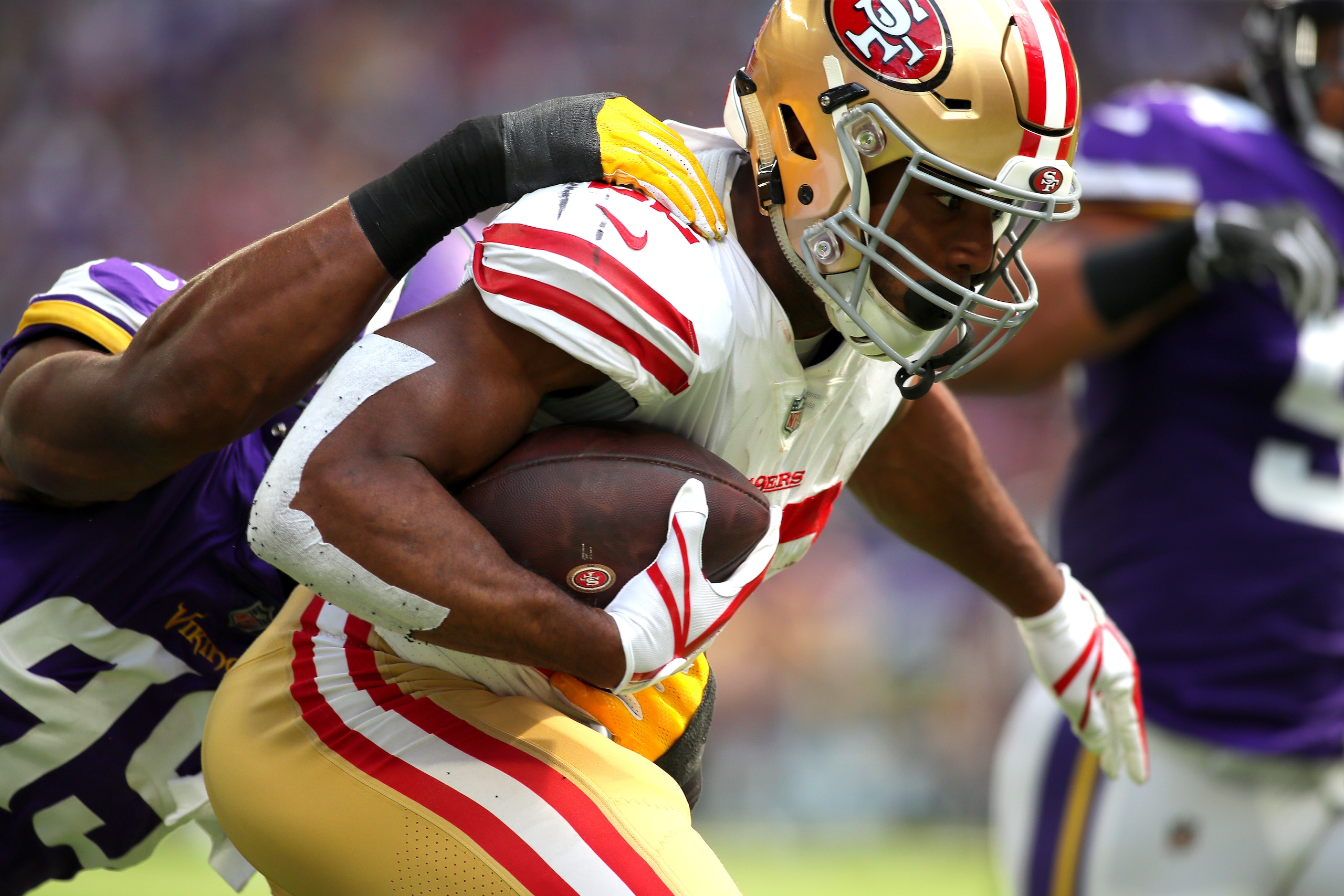 MINNEAPOLIS, MN - SEPTEMBER 09: Matt Breida #22 of the San Francisco 49ers is tackled with the ball by Danielle Hunter #99 of the Minnesota Vikings in the first half of the game at U.S. Bank Stadium on September 9, 2018 in Minneapolis, Minnesota. (Photo b
