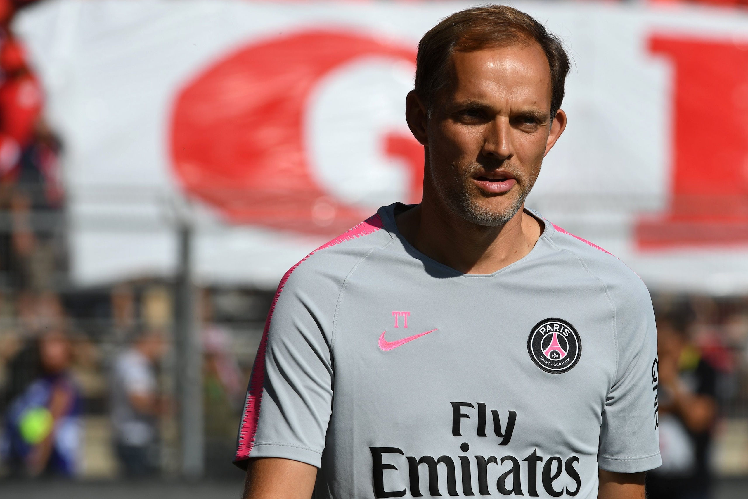 Paris Saint-Germain's German coach Thomas Tuchel enters the pitch before the French L1 football match between Nimes and Paris Saint-Germain (PSG), on September 1, 2018 at the Costieres stadium in Nimes, southern France. (Photo by Pascal GUYOT / AFP)      