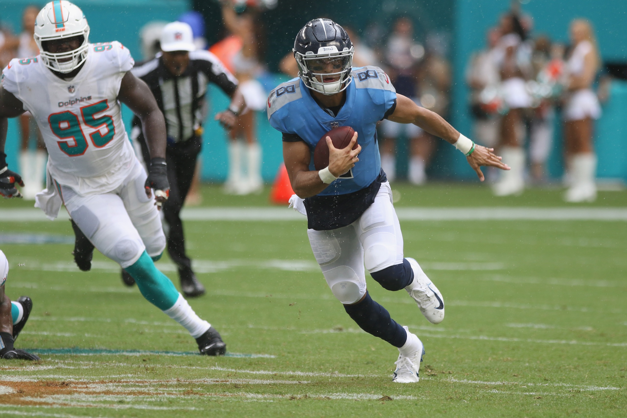 MIAMI, FL - SEPTEMBER 09: Quarterback Marcus Mariota #8 of the Tennessee Titans scrambles against the Miami Dolphins at Hard Rock Stadium on September 9, 2018 in Miami, Florida. The Dolphins defeated the Titans 27-20 after two rain delays in the longest MIAMI, FL - SEPTEMBER 09: Quarterback Marcus Mariota #8 of the Tennessee Titans scrambles against the Miami Dolphins at Hard Rock Stadium on September 9, 2018 in Miami, Florida. The Dolphins defeated the Titans 27-20 after two rain delays in the longest