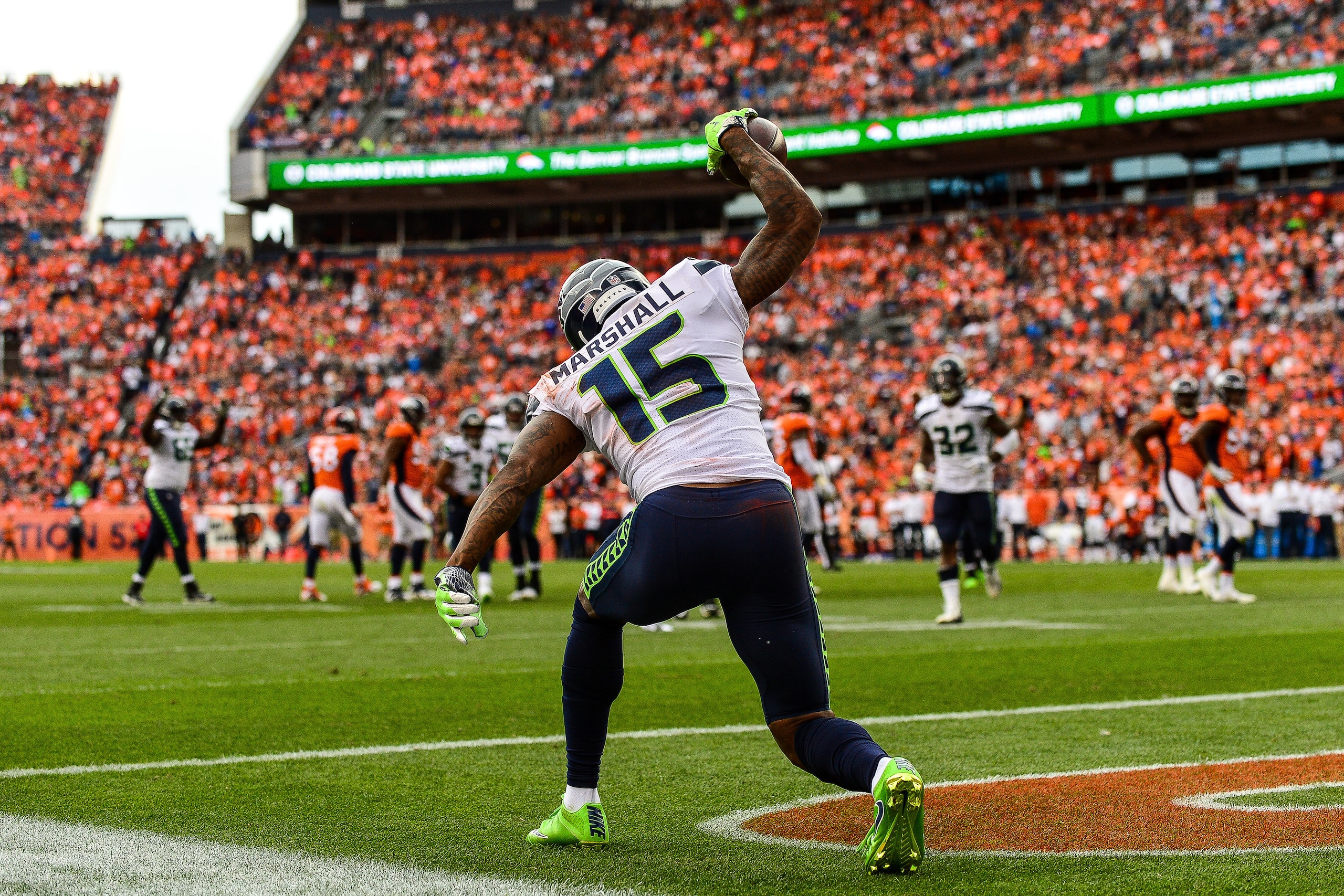 DENVER, CO - SEPTEMBER 9: Wide receiver Brandon Marshall #15 of the Seattle Seahawks celebrates after scoring a touchdown against the Denver Broncos in the third quarter of a game at Broncos Stadium at Mile High on September 9, 2018 in Denver, Colorado. DENVER, CO - SEPTEMBER 9: Wide receiver Brandon Marshall #15 of the Seattle Seahawks celebrates after scoring a touchdown against the Denver Broncos in the third quarter of a game at Broncos Stadium at Mile High on September 9, 2018 in Denver, Colorado.