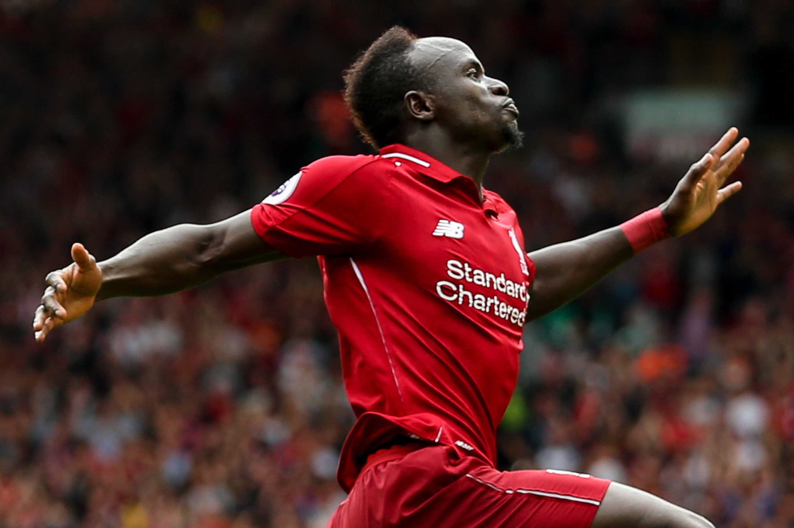 LIVERPOOL, ENGLAND - AUGUST 12: Sadio Mane of Liverpool celebrates after scoring a goal to make it 3-0 during the Premier League match between Liverpool FC and West Ham United at Anfield on August 12, 2018 in Liverpool, United Kingdom. (Photo by Robbie Ja