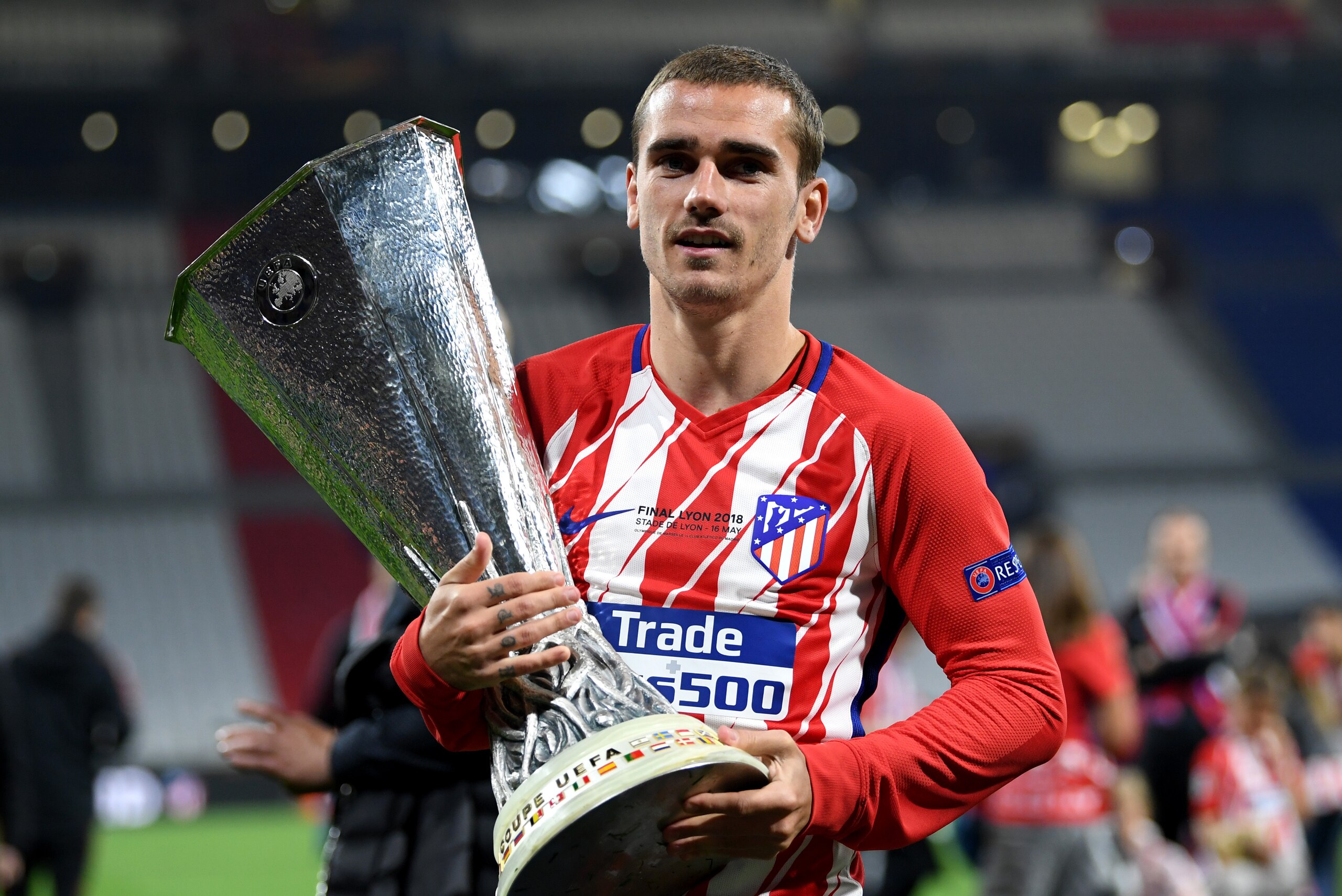 LYON, FRANCE - MAY 16:  Antoine Griezmann of Atletico Madrid celebrates with the trophy following the UEFA Europa League Final between Olympique de Marseille and Club Atletico de Madrid at Stade de Lyon on May 16, 2018 in Lyon, France.  (Photo by Matthias