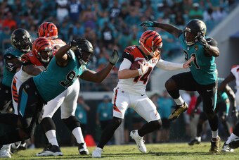 JACKSONVILLE, FL - NOVEMBER 05:  Yannick Ngakoue #91 and Calais Campbell #93 of the Jacksonville Jaguars put pressure on  Andy Dalton #14 of the Cincinnati Bengals in the second half of their game at EverBank Field on November 5, 2017 in Jacksonville, Flo