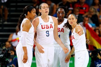 RIO DE JANEIRO, BRAZIL - AUGUST 20: Maya Moore #7, Breanna Stewart #9, Tina Charles #14 and Sue Bird #6 of United States talk on the court during the Women's Gold Medal Game between United States and Spain on Day 15 of the Rio 2016 Olympic Games at Carioc