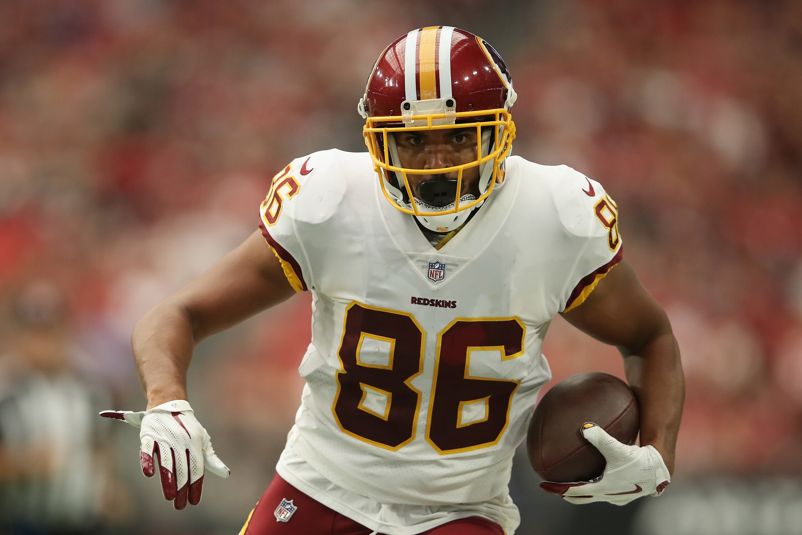 GLENDALE, AZ - SEPTEMBER 09: Tight end Jordan Reed #86 of the Washington Redskins runs with the football after a reception against the Arizona Cardinals during the NFL game at State Farm Stadium on September 9, 2018 in Glendale, Arizona. The Redskins def GLENDALE, AZ - SEPTEMBER 09: Tight end Jordan Reed #86 of the Washington Redskins runs with the football after a reception against the Arizona Cardinals during the NFL game at State Farm Stadium on September 9, 2018 in Glendale, Arizona. The Redskins def