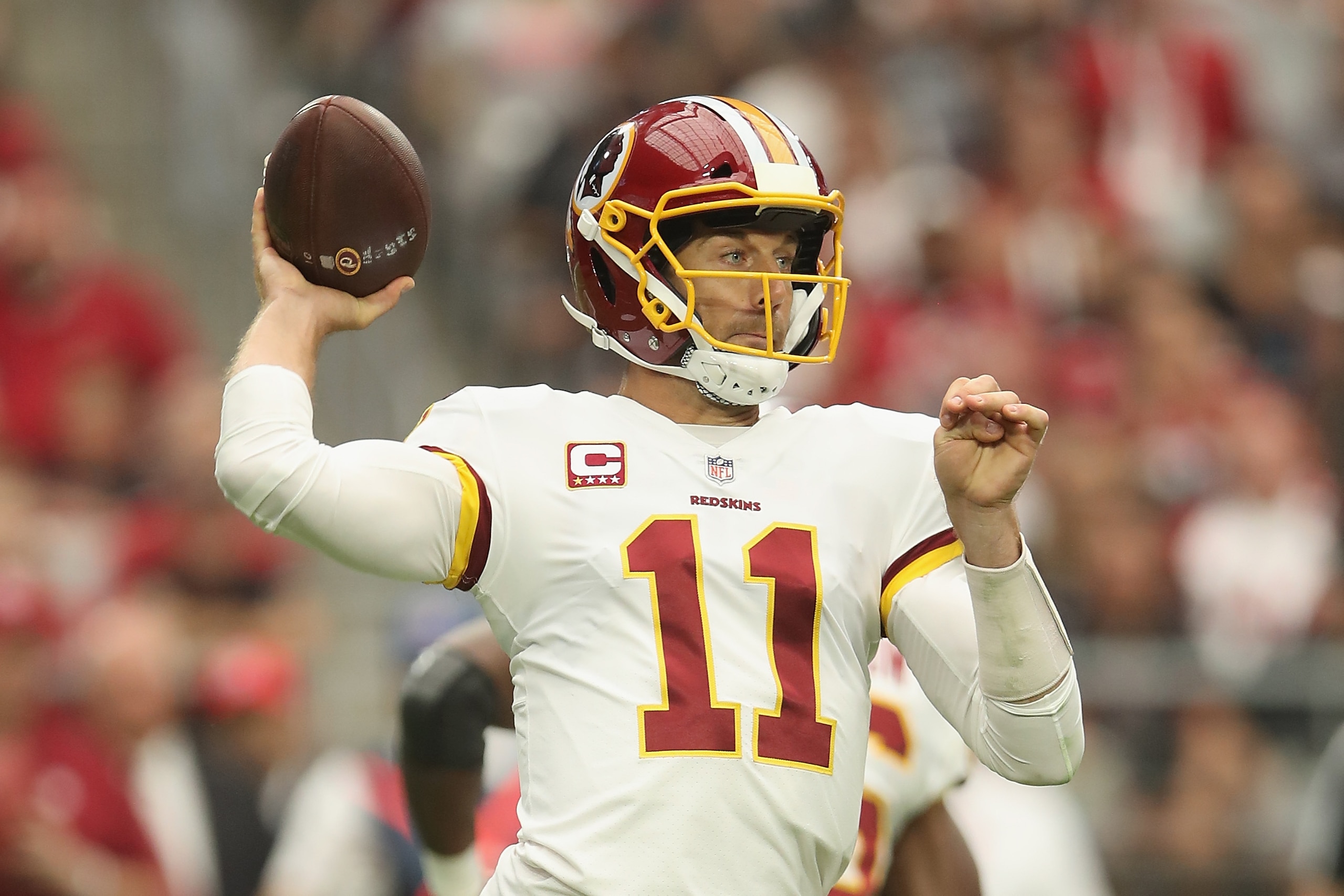 GLENDALE, AZ - SEPTEMBER 09:  Quarterback Alex Smith #11 of the Washington Redskins drops back to pass during the NFL game against the Arizona Cardinals at State Farm Stadium on September 9, 2018 in Glendale, Arizona. The Redskins defeated the Cardinals 2