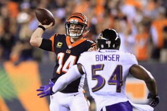 CINCINNATI, OH - SEPTEMBER 13:  Andy Dalton #14 of the Cincinnati Bengals throws a pass against Tyus Bowser #54 of the Baltimore Ravens during the first half at Paul Brown Stadium on September 13, 2018 in Cincinnati, Ohio.  (Photo by Andy Lyons/Getty Imag
