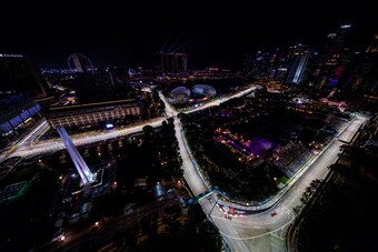 SINGAPORE - SEPTEMBER 14: Sebastian Vettel of Germany driving the (5) Scuderia Ferrari SF71H leads Daniel Ricciardo of Australia driving the (3) Aston Martin Red Bull Racing RB14 TAG Heuer and Lewis Hamilton of Great Britain driving the (44) Mercedes AMG 