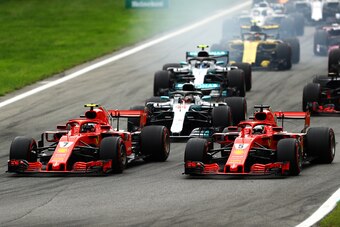 MONZA, ITALY - SEPTEMBER 02:  Kimi Raikkonen of Finland driving the (7) Scuderia Ferrari SF71H and Sebastian Vettel of Germany driving the (5) Scuderia Ferrari SF71H race to the first corner ahead of Lewis Hamilton of Great Britain driving the (44) Merced