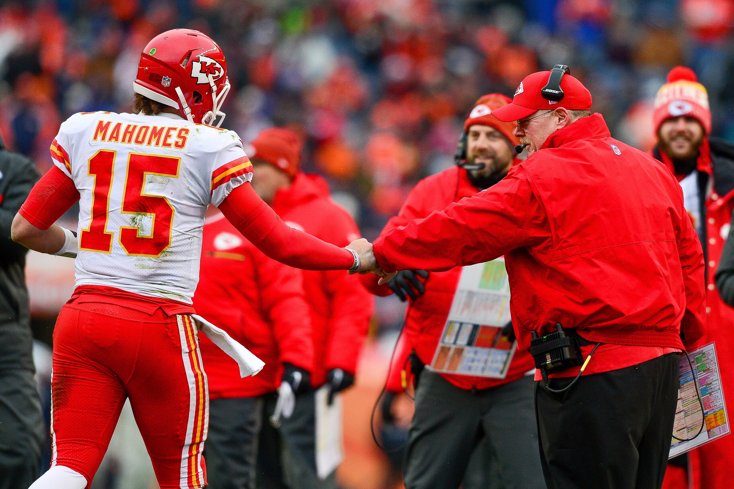 DENVER, CO - DECEMBER 31:  Head coach Andy Reid of the Kansas City Chiefs celebrates with quarterback Patrick Mahomes #15 after the Kansas City Chiefs offense scored a touchdown against the Denver Broncosat Sports Authority Field at Mile High on December 