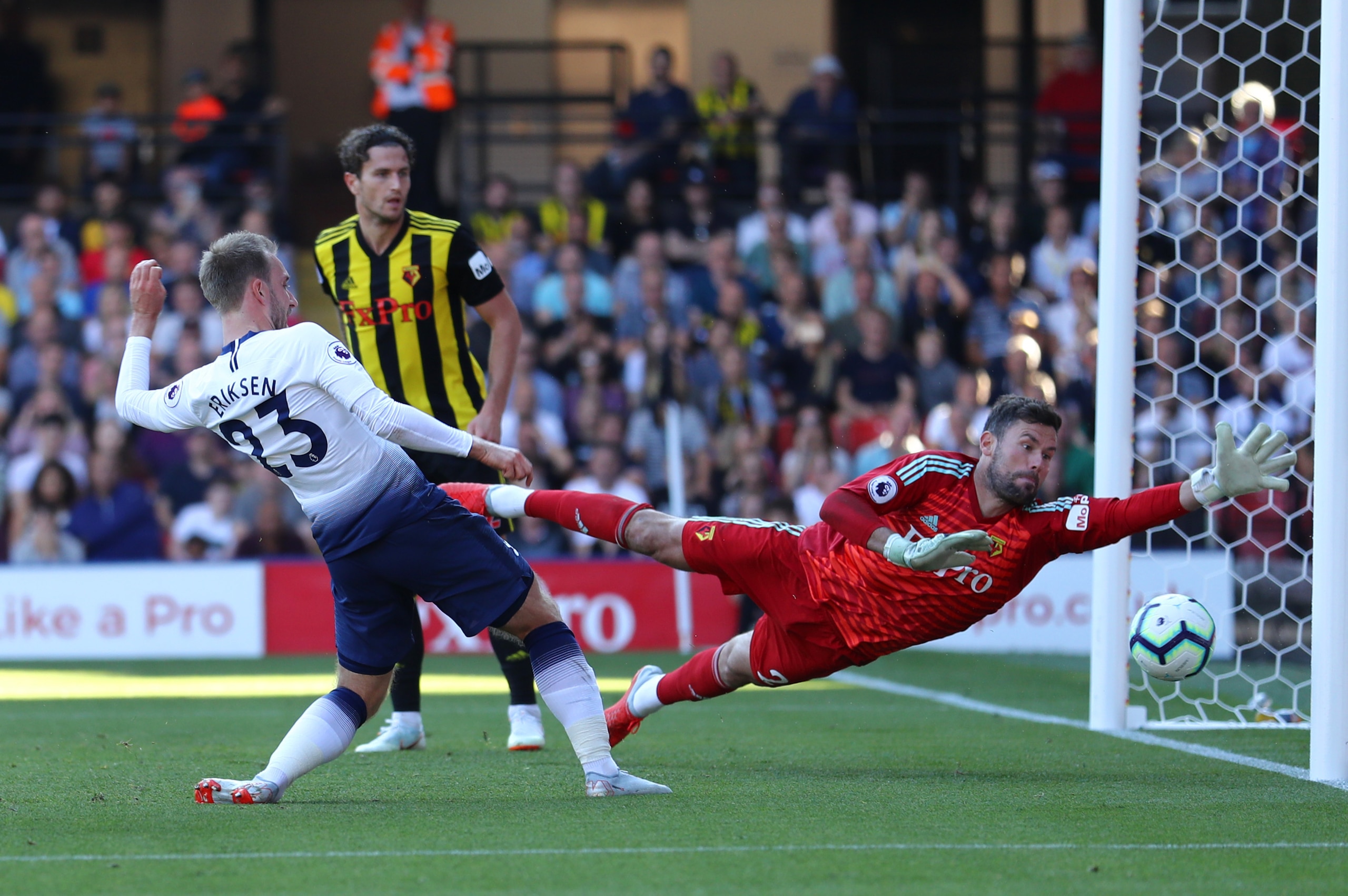 WATFORD, ENGLAND - SEPTEMBER 02:  Ben Foster of Watford fails to stop an own goal by Abdoulaye Doucoure of Watford (not pictured) as  Christian Eriksen of Tottenham Hotspur stretches for the ball for their first goal during the Premier League match betwee