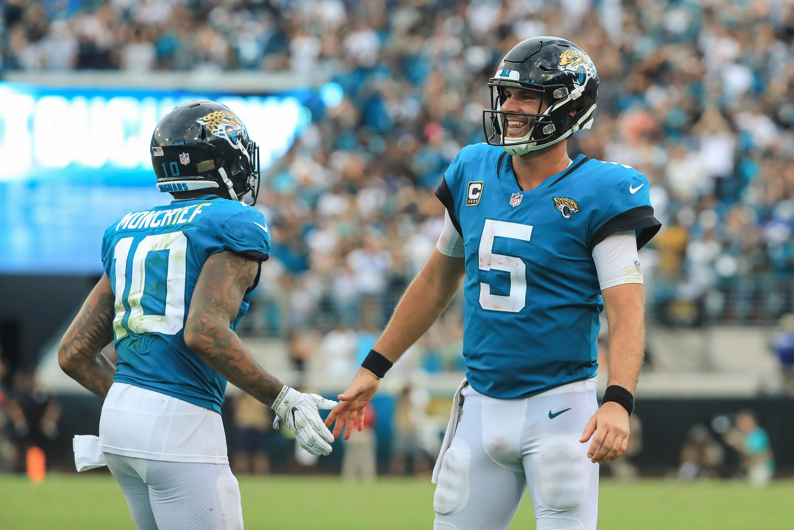 JACKSONVILLE, FL - SEPTEMBER 16: Blake Bortles #5 of the Jacksonville Jaguars laughs while high-fiving Donte Moncrief #10 of the Jacksonville Jaguars during the second half against the New England Patriots at TIAA Bank Field on September 16, 2018 in Jacks JACKSONVILLE, FL - SEPTEMBER 16: Blake Bortles #5 of the Jacksonville Jaguars laughs while high-fiving Donte Moncrief #10 of the Jacksonville Jaguars during the second half against the New England Patriots at TIAA Bank Field on September 16, 2018 in Jacks