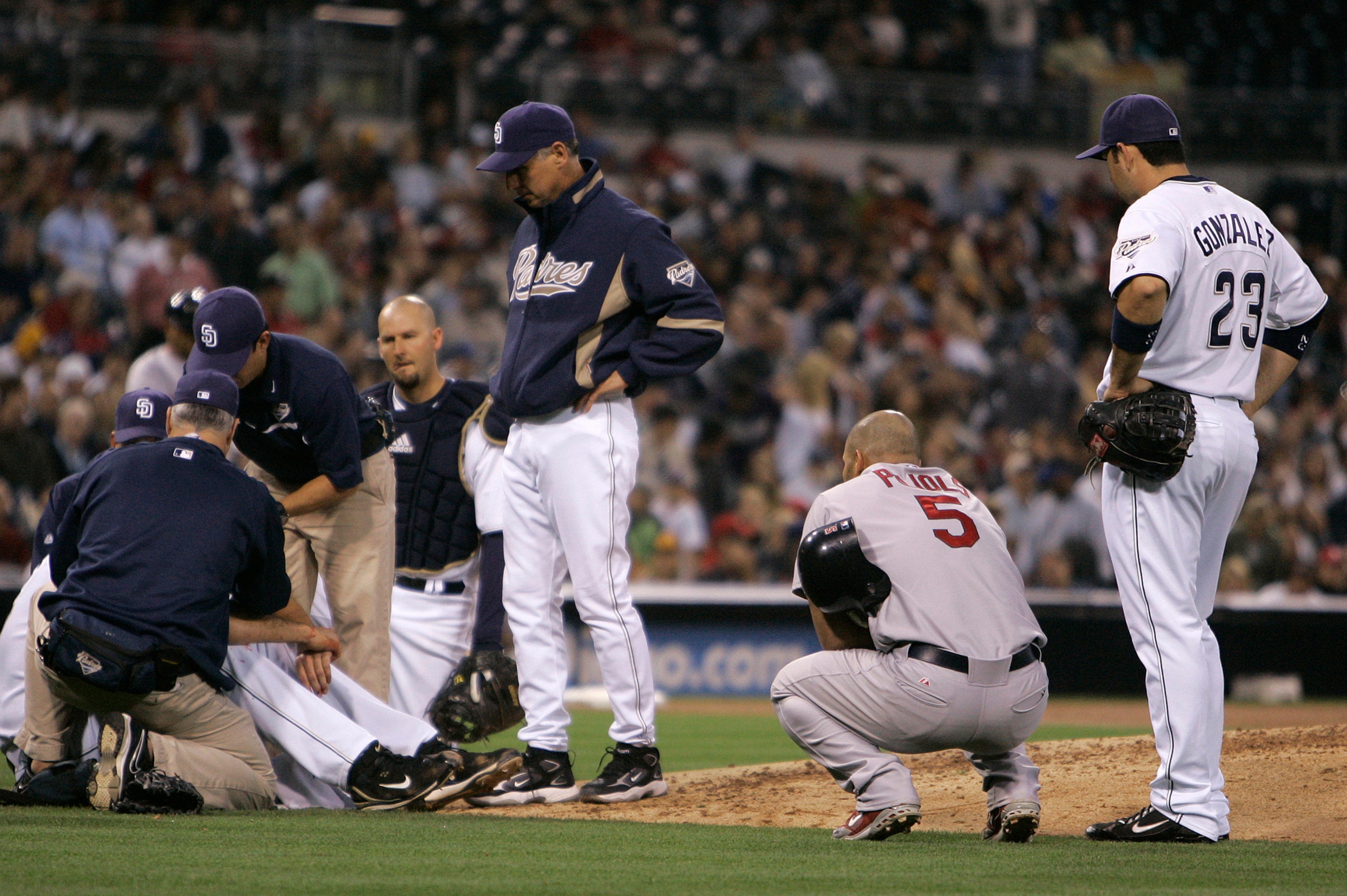 Albert Pujols looked on after his line drive hit Young in the face.
