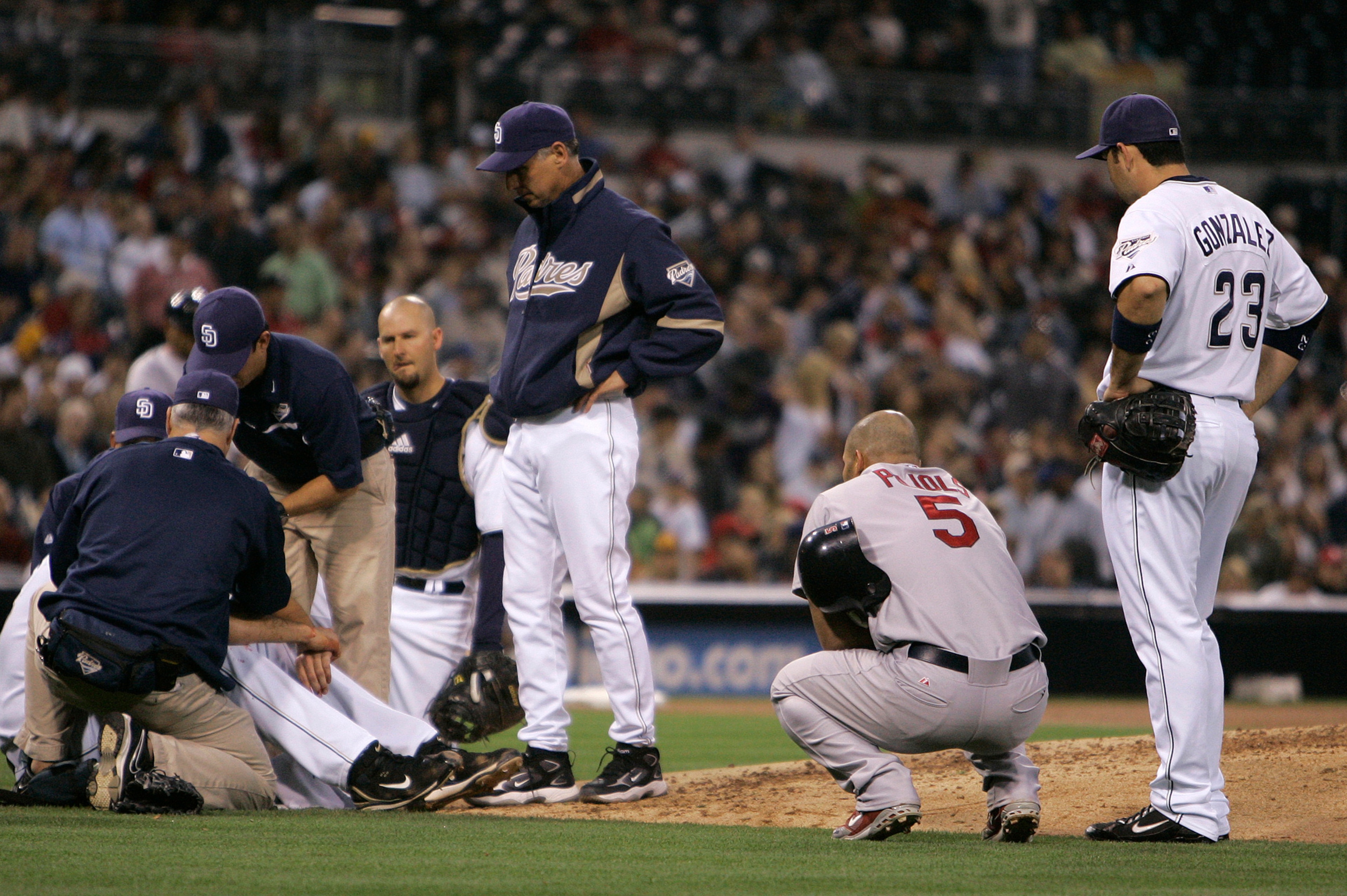 Albert Pujols looked on after his line drive hit Young in the face.