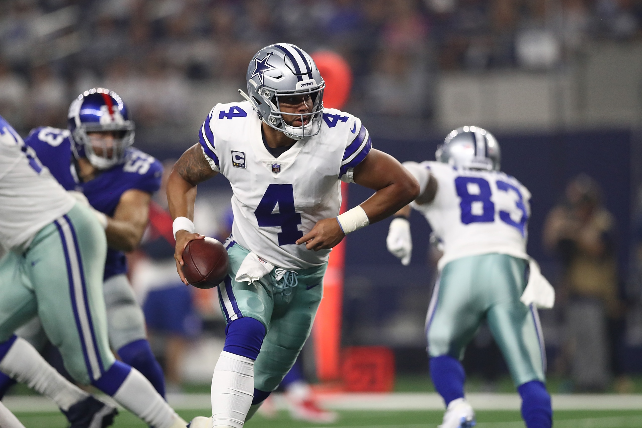 ARLINGTON, TX - SEPTEMBER 16: Dak Prescott #4 of the Dallas Cowboys at AT&T Stadium on September 16, 2018 in Arlington, Texas. (Photo by Ronald Martinez/Getty Images) ARLINGTON, TX - SEPTEMBER 16: Dak Prescott #4 of the Dallas Cowboys at AT&T Stadium on September 16, 2018 in Arlington, Texas. (Photo by Ronald Martinez/Getty Images)