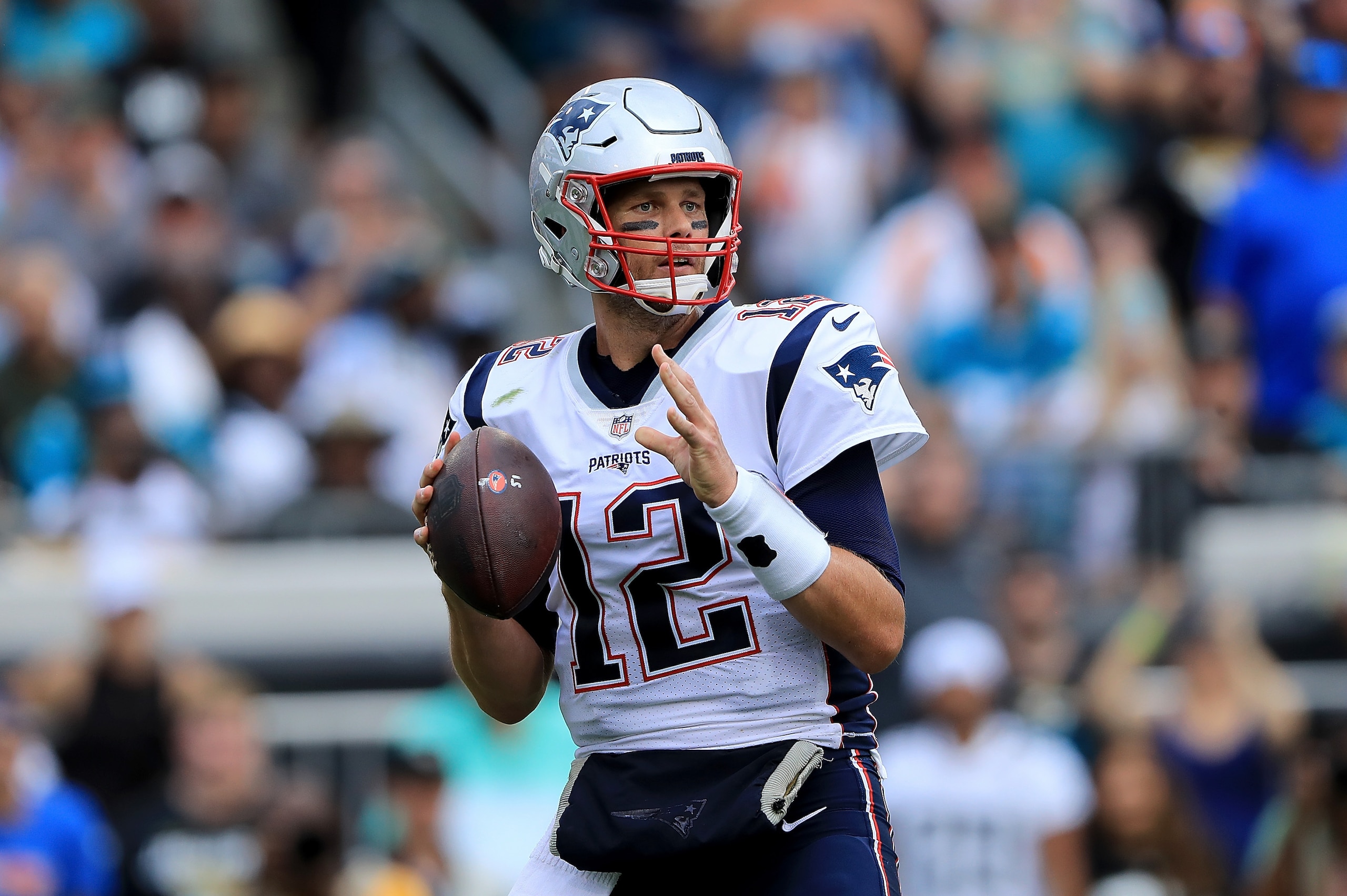 JACKSONVILLE, FL - SEPTEMBER 16:  Tom Brady #12 of the New England Patriots attempts a pass during the game against the Jacksonville Jaguars at TIAA Bank Field on September 16, 2018 in Jacksonville, Florida.  (Photo by Sam Greenwood/Getty Images)