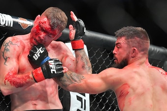 LAS VEGAS, NV - JULY 07:  Mike Perry (R) throws a punch at Paul Felder during their welterweight fight at T-Mobile Arena on July 7, 2018 in Las Vegas, Nevada. Perry won by split decision.  (Photo by Sam Wasson/Getty Images)