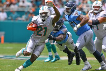 MIAMI, FL - SEPTEMBER 09: Frank Gore #21 of the Miami Dolphins runs with the ball during the game against the Tennessee Titans at Hard Rock Stadium on September 9, 2018 in Miami, Florida. (Photo by Mark Brown/Getty Images)