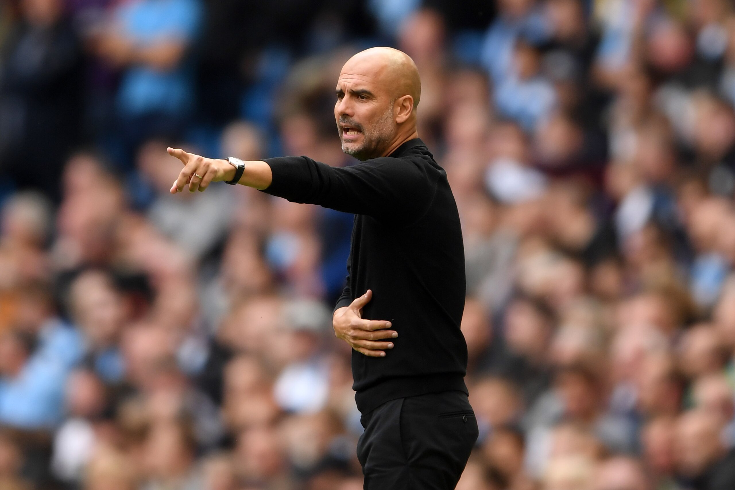 MANCHESTER, ENGLAND - SEPTEMBER 15: Josep Guardiola of Manchester City looks on during the Premier League match between Manchester City and Fulham FC at Etihad Stadium on September 15, 2018 in Manchester, United Kingdom. (Photo by Laurence Griffiths/Getty