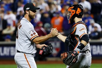 NEW YORK, NY - OCTOBER 05:  Madison Bumgarner #40 and Buster Posey #28 of the San Francisco Giants celebrate their 3-0 win over the New York Mets during their National League Wild Card game at Citi Field on October 5, 2016 in New York City.  (Photo by Al 