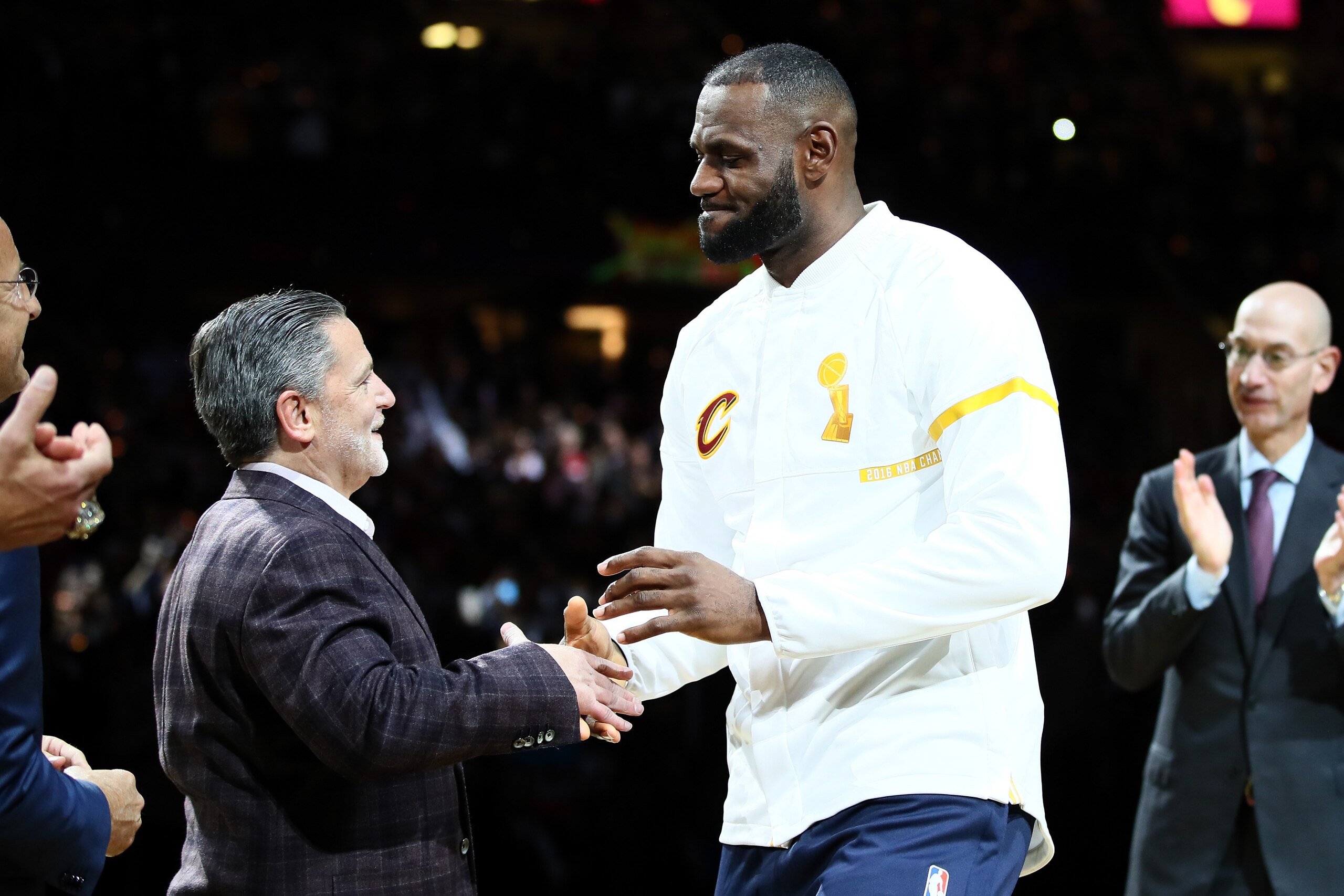 CLEVELAND, OH - OCTOBER 25: LeBron James #23 of the Cleveland Cavaliers recieves his championship ring from owner Dan Gilbert before the game against the New York Knicks at Quicken Loans Arena on October 25, 2016 in Cleveland, Ohio. NOTE TO USER: User e CLEVELAND, OH - OCTOBER 25: LeBron James #23 of the Cleveland Cavaliers recieves his championship ring from owner Dan Gilbert before the game against the New York Knicks at Quicken Loans Arena on October 25, 2016 in Cleveland, Ohio. NOTE TO USER: User e