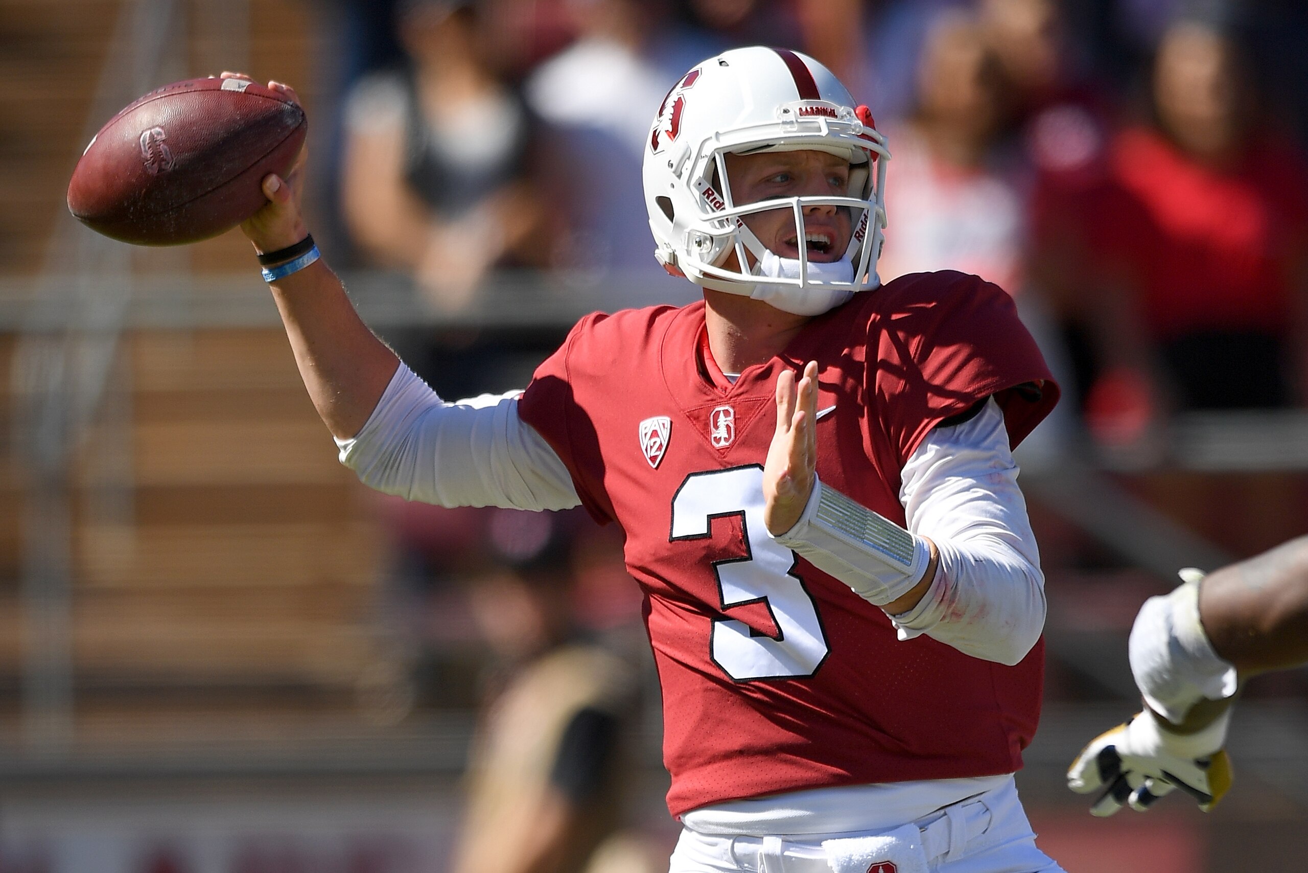 PALO ALTO, CA - SEPTEMBER 15:  K.J. Costello #3 of the Stanford Cardinal drops back to pass against the UC Davis Aggies during the first quarter of an NCAA football game at Stanford Stadium on September 15, 2018 in Palo Alto, California.  (Photo by Thearo