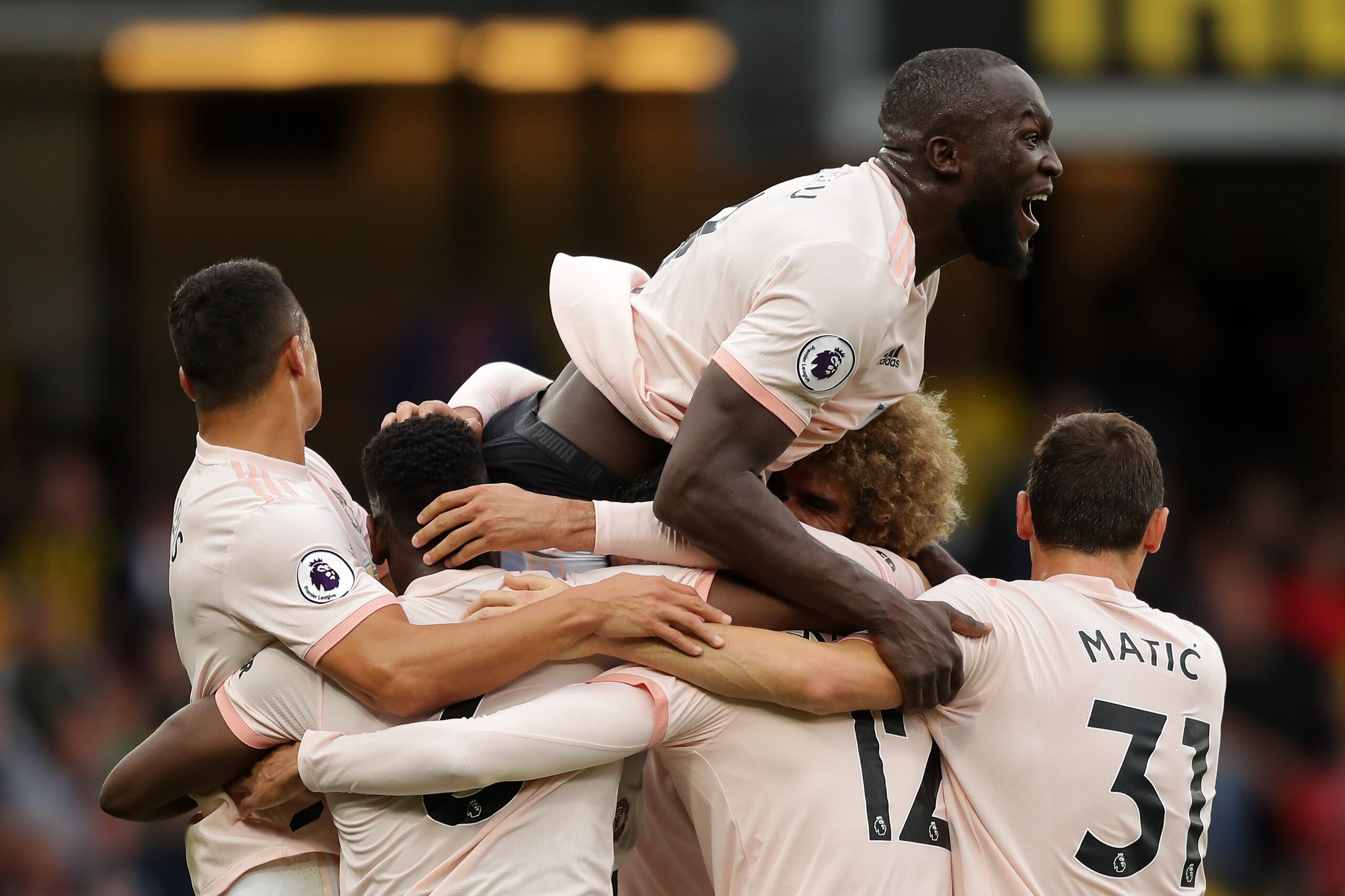 WATFORD, ENGLAND - SEPTEMBER 15:  Chris Smalling of Manchester United celebrates with teammates after scoring his team's second goal during the Premier League match between Watford FC and Manchester United at Vicarage Road on September 15, 2018 in Watford