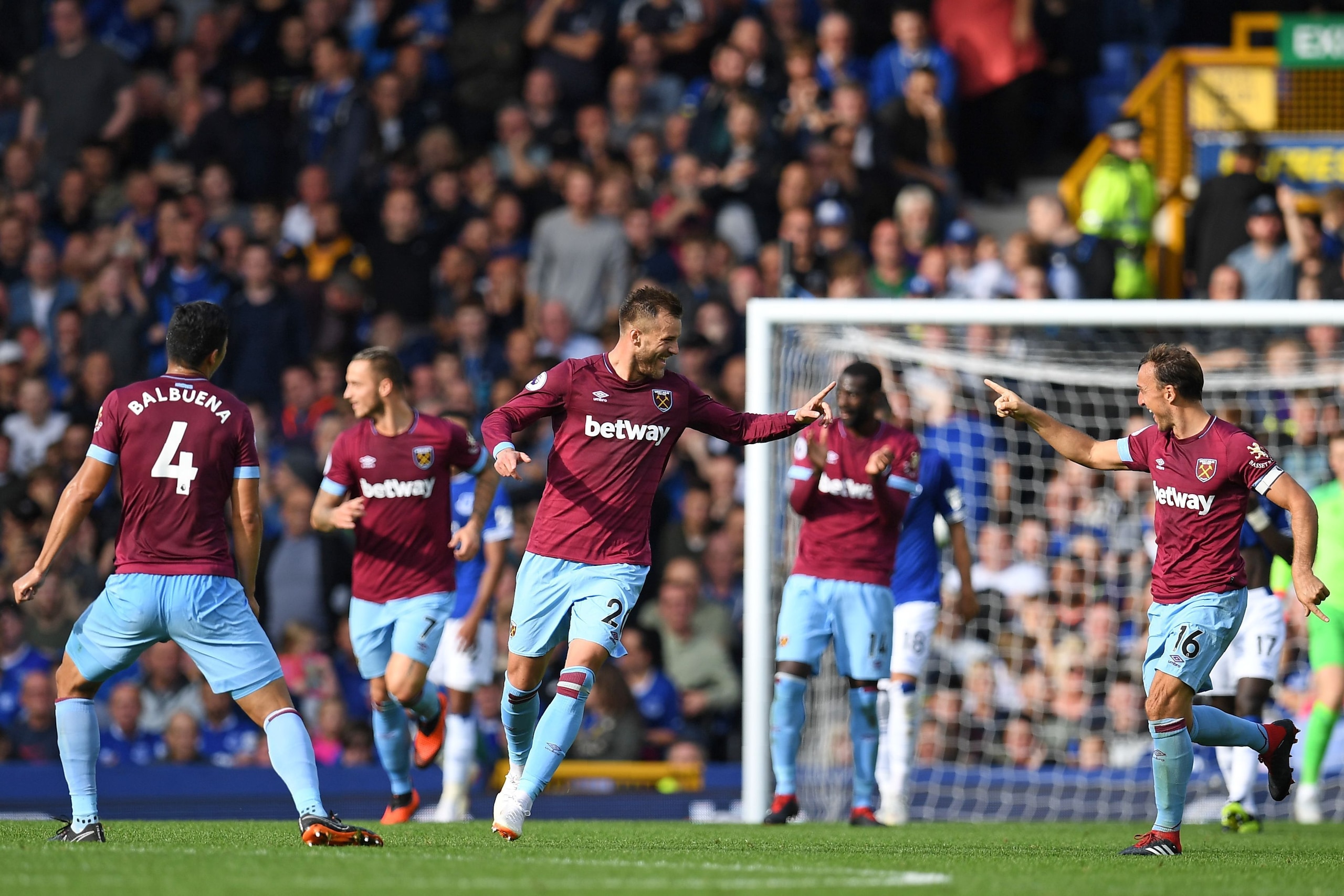 West Ham United's Ukrainian striker Andriy Yarmolenko (C) celebrates with teammates after scoring their second goal during the English Premier League football match between Everton and West Ham United at Goodison Park in Liverpool, north west England on S