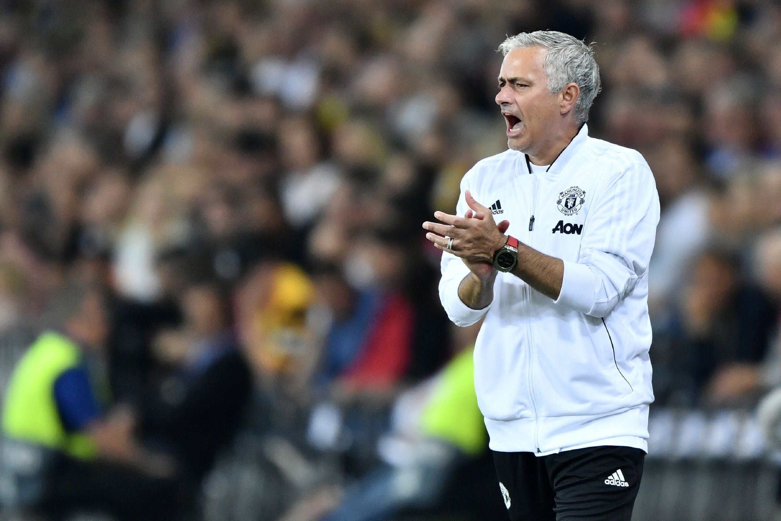 Manchester United's Portuguese manager Jose Mourinho shouts at his players from the touchline during the UEFA Champions League group H football match between Young Boys and Manchester United at The Stade de Suisse in Bern on September 19, 2018. (Photo by 