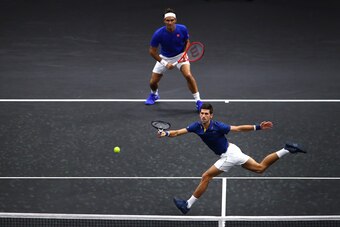 CHICAGO, IL - SEPTEMBER 21:  Team Europe Novak Djokovic of Serbia returns a shot with Team Europe Roger Federer of Switzerland against Team World Jack Sock of the United States and Team World Kevin Anderson of South Africa during their Men's Doubles match