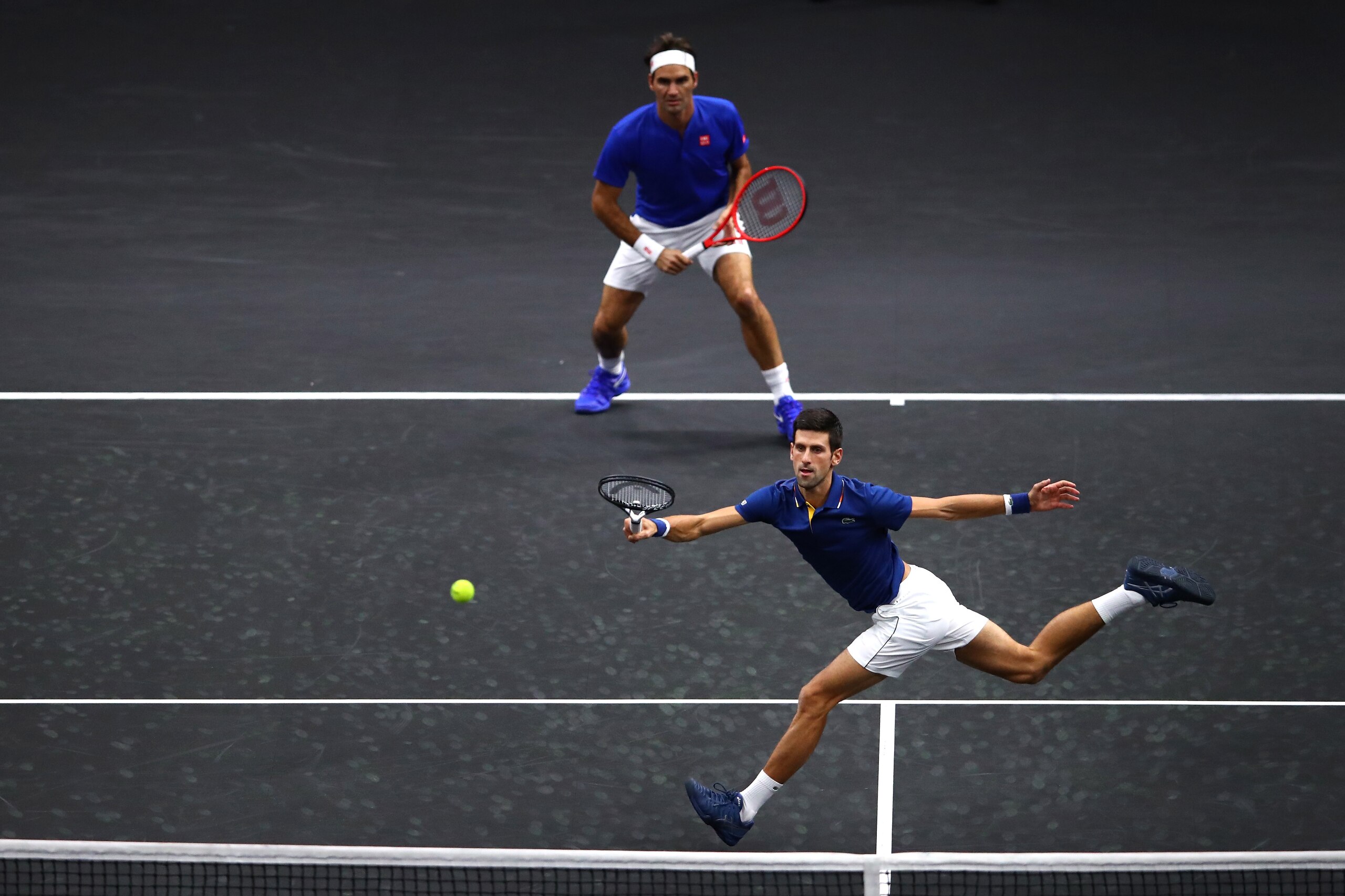 CHICAGO, IL - SEPTEMBER 21:  Team Europe Novak Djokovic of Serbia returns a shot with Team Europe Roger Federer of Switzerland against Team World Jack Sock of the United States and Team World Kevin Anderson of South Africa during their Men's Doubles match
