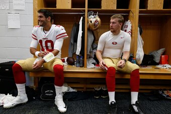 CHICAGO, IL - DECEMBER 3: Jimmy Garoppolo #10 and C.J. Beathard #3 of the San Francisco 49ers sit in the locker room prior to the game against the Chicago Bears at Soldier Field on December 3, 2017 in Chicago, Illinois. The 49ers defeated the Bears 15-14.