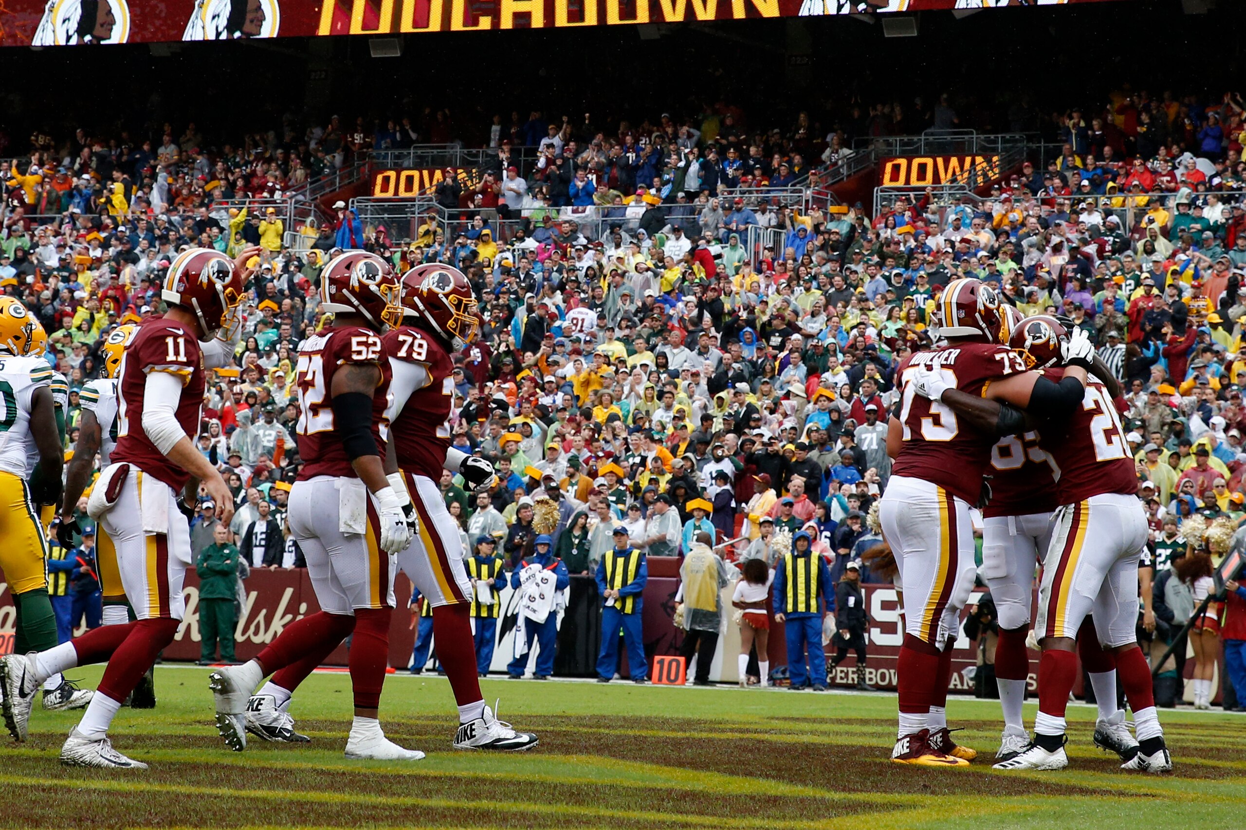 LANDOVER, MD - SEPTEMBER 23: Adrian Peterson #26 of the Washington Redskins celebrates with teammates after a first quarter touchdown against the Green Bay Packers at FedExField on September 23, 2018 in Landover, Maryland. (Photo by Todd Olszewski/Getty I