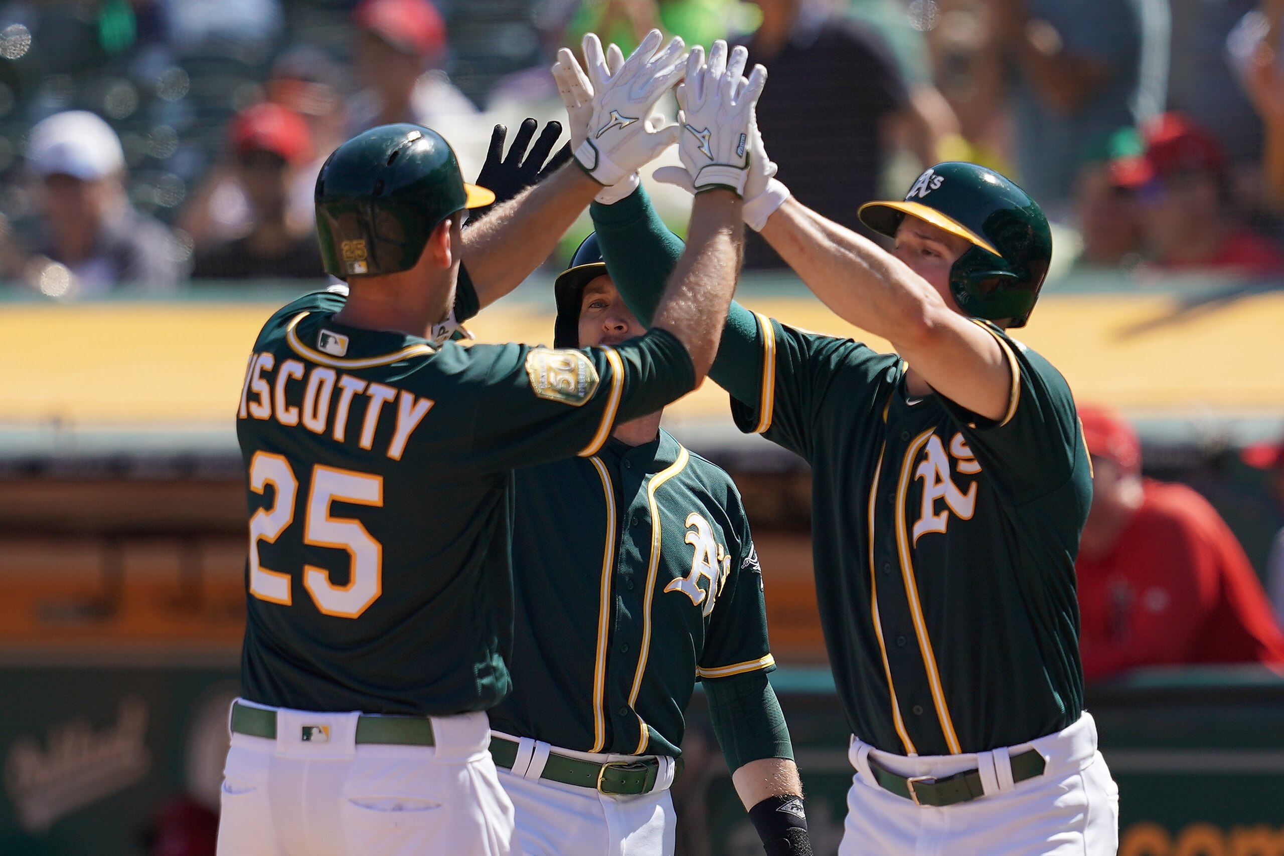 OAKLAND, CA - SEPTEMBER 20: Stephen Piscotty #25 of the Oakland Athletics is congratulated by Jed Lowrie #8 and Matt Chapman #26 after Piscotty hit a three-run home run against the Los Angeles Angels of Anaheim in the bottom of the third inning at Oaklan OAKLAND, CA - SEPTEMBER 20: Stephen Piscotty #25 of the Oakland Athletics is congratulated by Jed Lowrie #8 and Matt Chapman #26 after Piscotty hit a three-run home run against the Los Angeles Angels of Anaheim in the bottom of the third inning at Oaklan