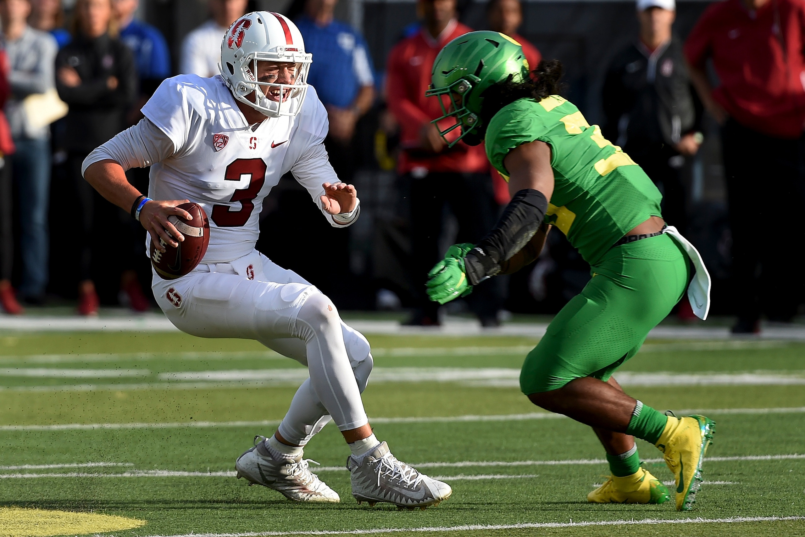EUGENE, OR - SEPTEMBER 22: Quarterback K.J. Costello (3) of the Stanford Cardinal is tackled by linebacker Kaulana Apelu #39 of the Oregon Ducks during the first quarter of the game at Autzen Stadium on September 22, 2018 in Eugene, Oregon. (Photo by St EUGENE, OR - SEPTEMBER 22: Quarterback K.J. Costello (3) of the Stanford Cardinal is tackled by linebacker Kaulana Apelu #39 of the Oregon Ducks during the first quarter of the game at Autzen Stadium on September 22, 2018 in Eugene, Oregon. (Photo by St
